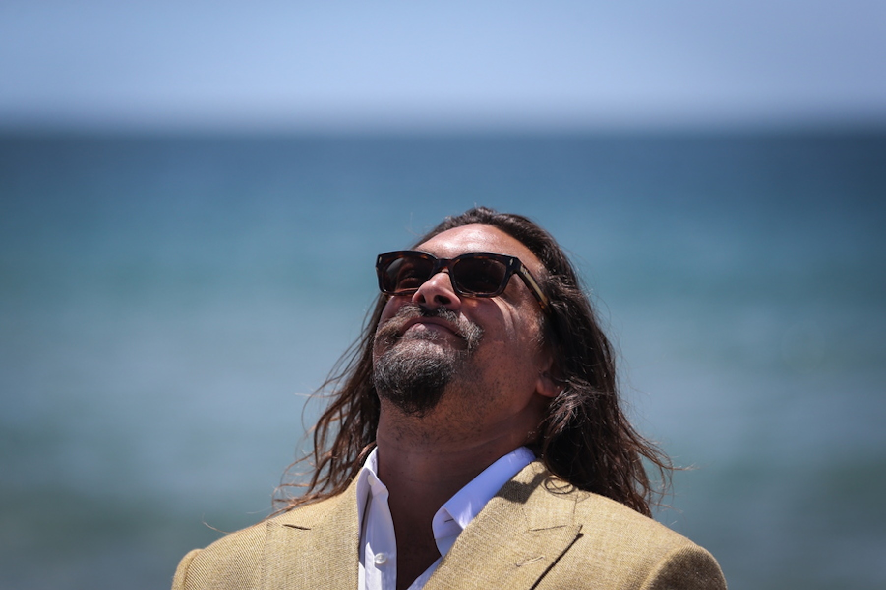epa10035305 Actor Jason Momoa arriving at the UN Ocean Conference Youth and Innovation Forum close ceremony at Carcavelos beach in Cascais, Portugal, 26 June 2022.  EPA