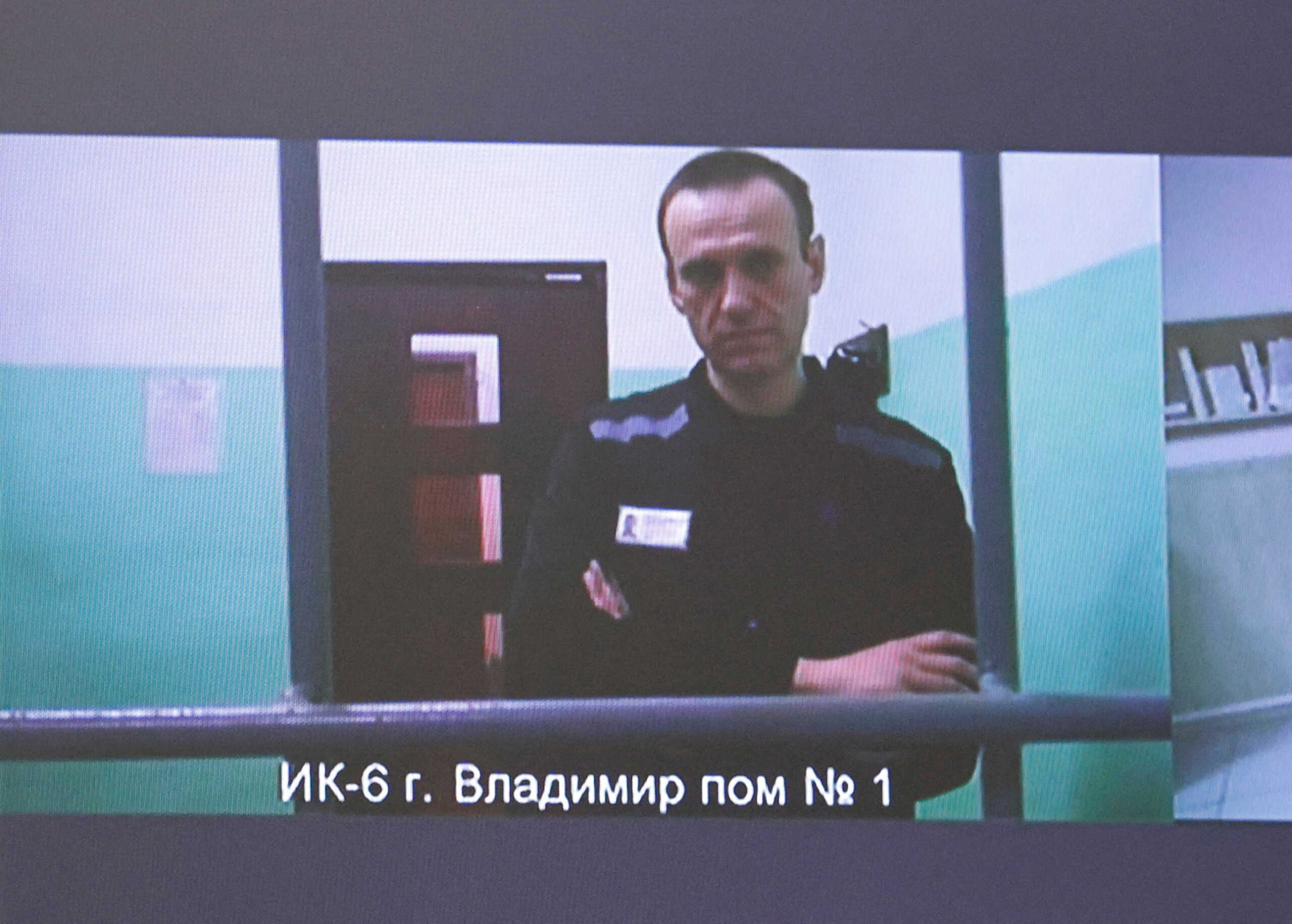 Russian opposition politician Alexei Navalny appears on a screen via video link from the IK-6 penal colony in the Vladimir region, during a court hearing to consider an appeal against his sentence in the criminal case on numerous charges, including the creation of an extremist organization, in Moscow, Russia September 26, 2023. REUTERS
