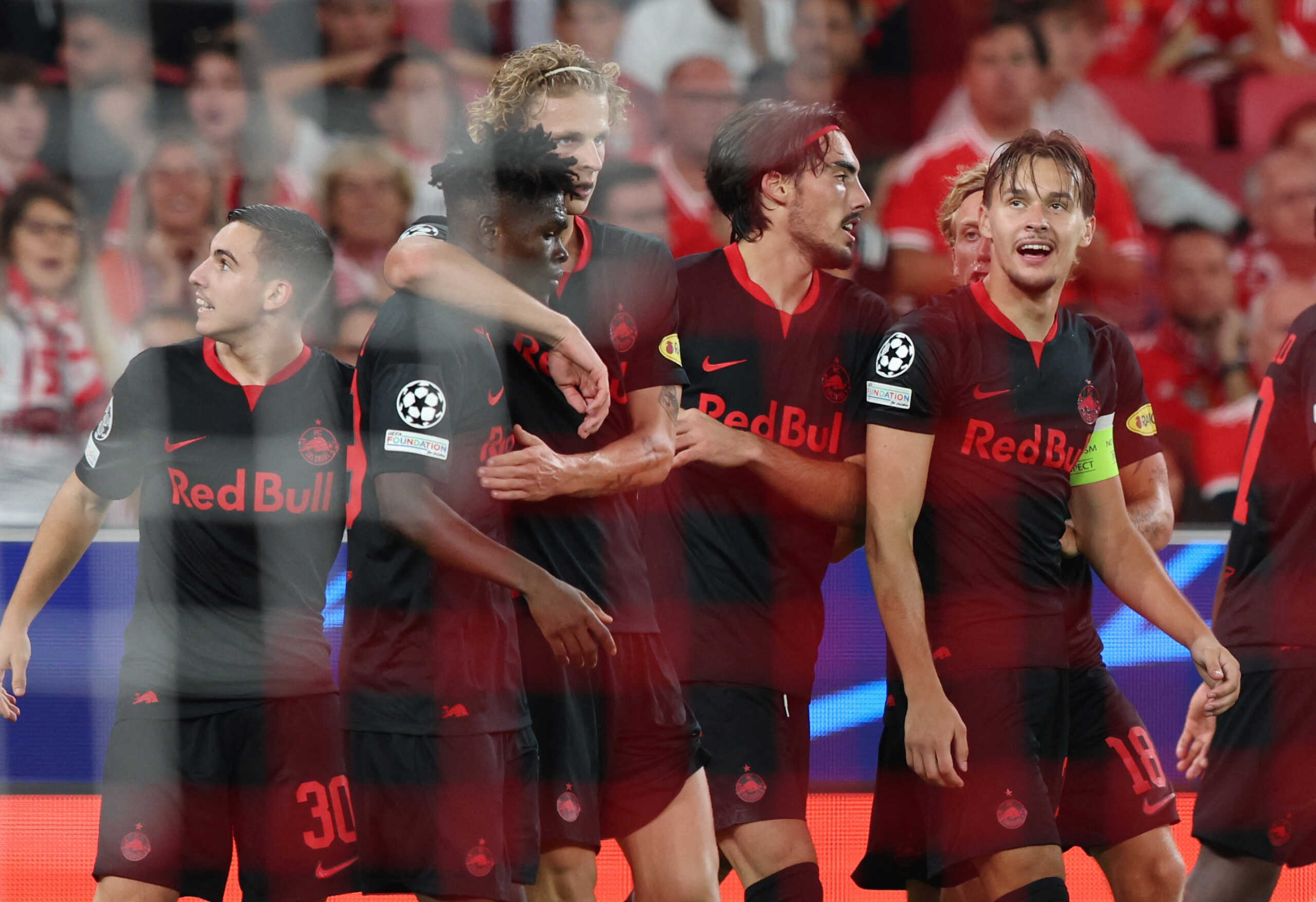 Soccer Football - Champions League - Group D - Benfica v FC Salzburg - Estadio da Luz, Lisbon, Portugal - September 20, 2023 FC Salzburg's Oscar Gloukh celebrates scoring their second goal with teammates REUTERS