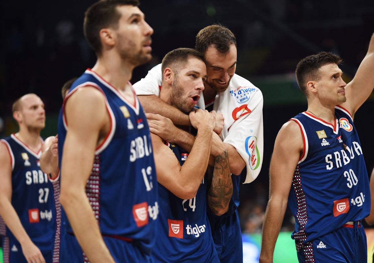 Basketball - FIBA World Cup 2023 - Quarter-Final - Lithuania v Serbia - Mall of Asia Arena, Manila, Philippines - September 5, 2023 Serbia's Stefan Jovic celebrates with teammates after winning the match REUTERS