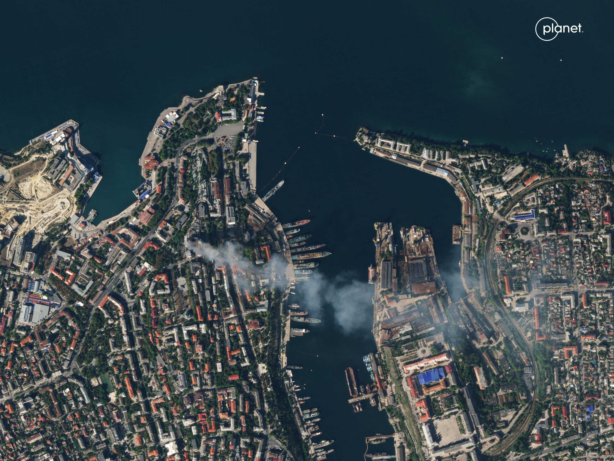 A satellite image shows smoke billowing from a Russian Black Sea Navy HQ after a missile strike, as Russia's invasion of Ukraine continues, in Sevastopol, Crimea, September 22, 2023.  PLANET LABS PBC