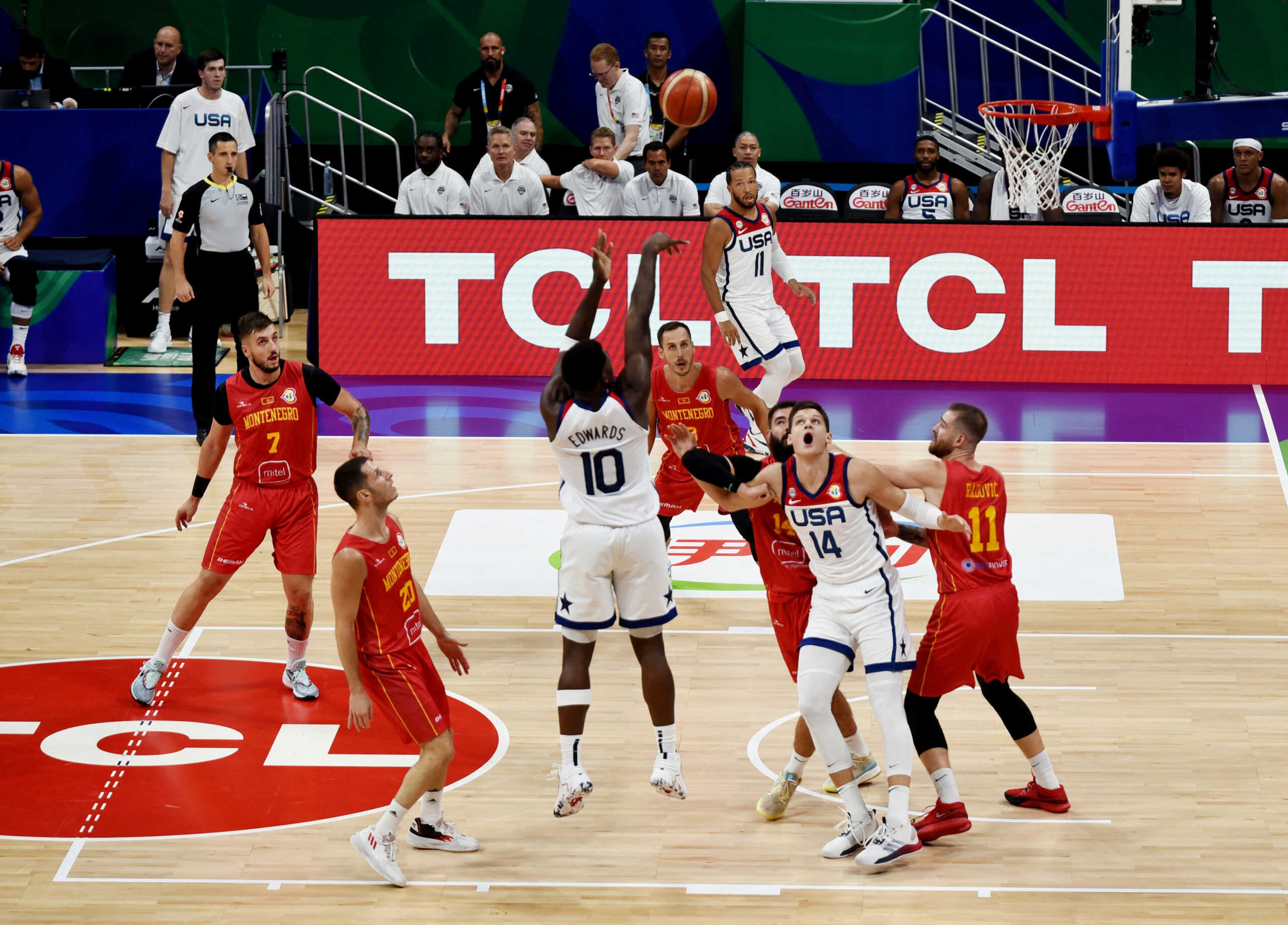 Basketball - FIBA World Cup 2023 - Second Round - Group J - United States v Montenegro - Mall of Asia Arena, Manila, Philippines - September 1, 2023 Anthony Edwards of the U.S. and Walker Kessler of the U.S. in action with Montenegro's Bojan Dubljevic and Montenegro's Nemanja Radovic REUTERS