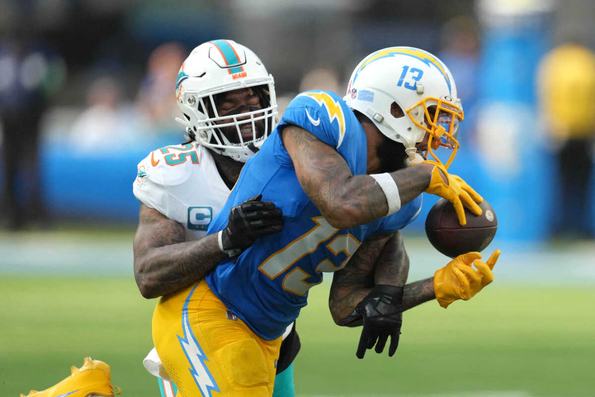 Sep 10, 2023; Inglewood, California, USA; Los Angeles Chargers wide receiver Keenan Allen (13) attempts to catch the ball against Miami Dolphins cornerback Xavien Howard (25) in the second half at SoFi Stadium. Mandatory Credit: Kirby Lee-USA TODAY Sports