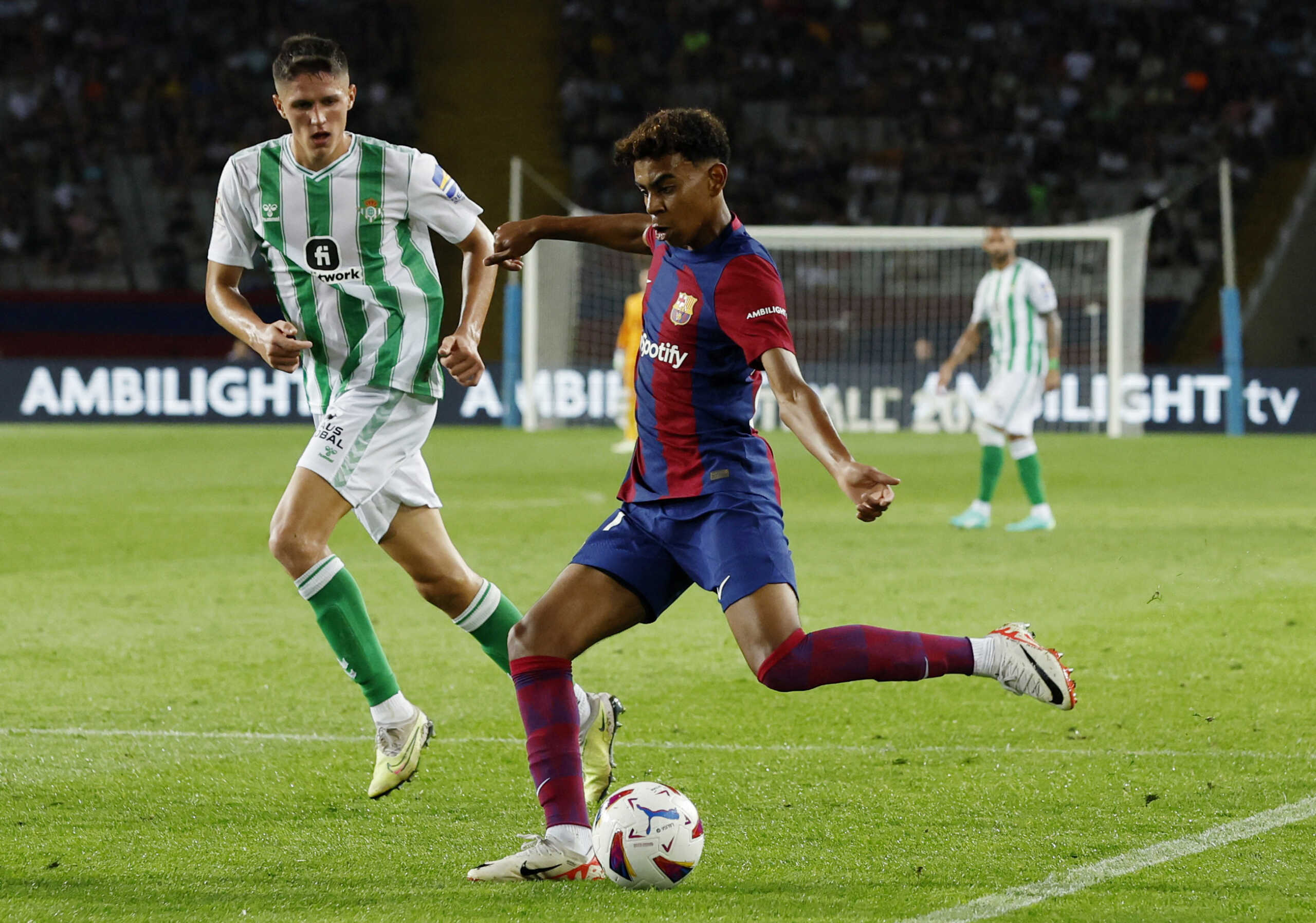 Soccer Football - LaLiga - FC Barcelona v Real Betis - Estadi Olimpic Lluis Companys, Barcelona, Spain - September 16, 2023 FC Barcelona's Lamine Yamal in action Real Betis' Sergi Altimira REUTERS