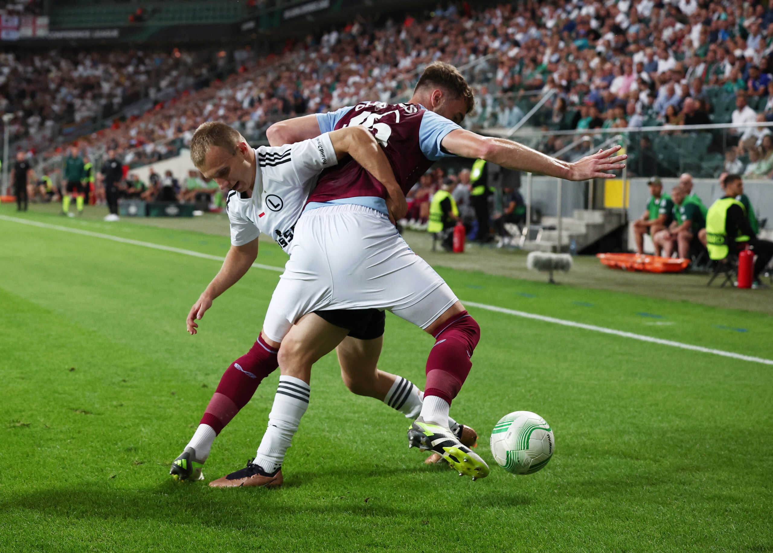 Soccer Football - Europa Conference League - Group E - Legia Warsaw v Aston Villa - Stadion Wojska Polskiego, Warsaw, Poland - September 21, 2023 Aston Villa's Calum Chambers in action with Legia Warsaw's Patrick Kun REUTERS