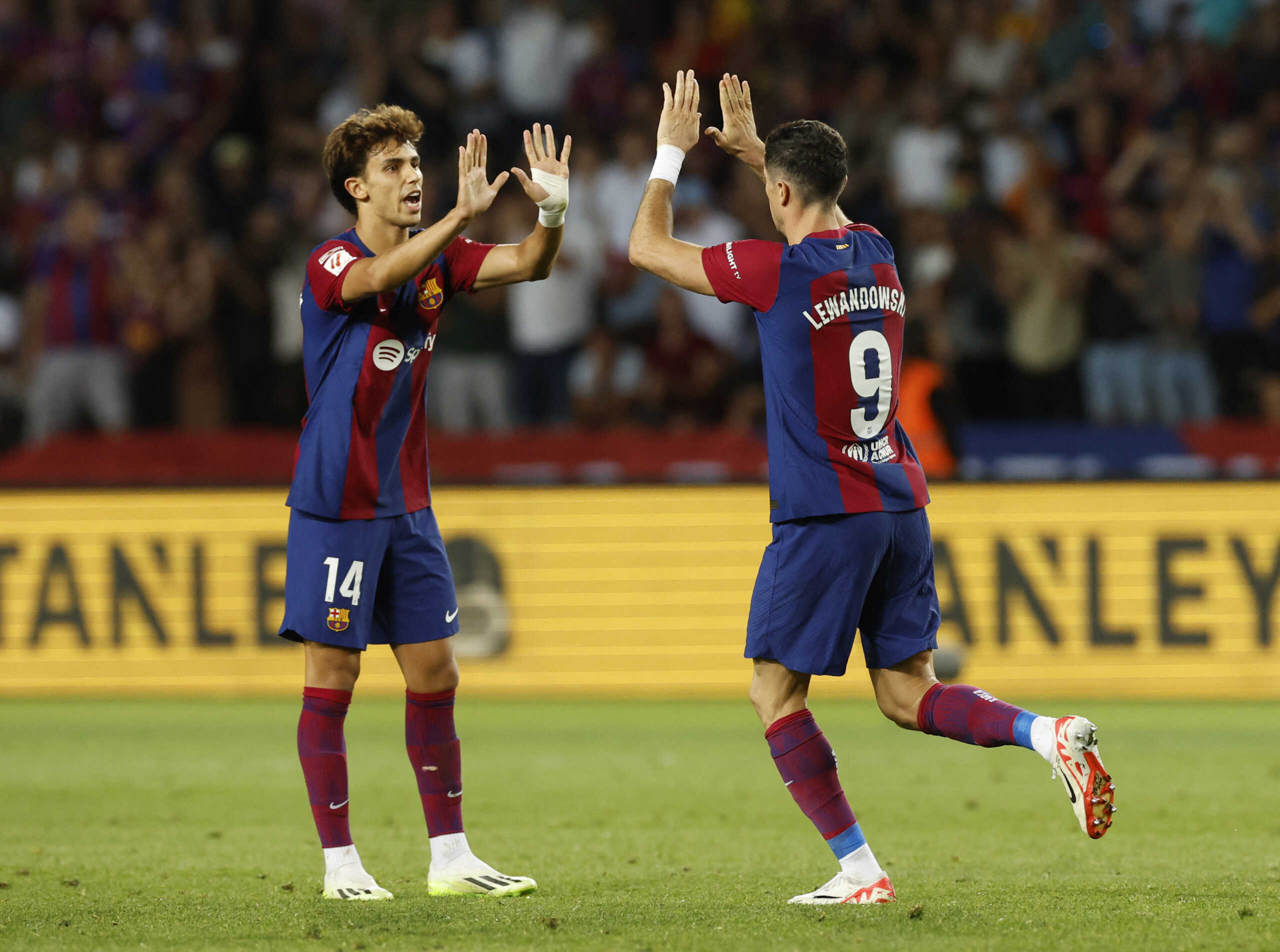 Soccer Football - LaLiga - FC Barcelona v Celta Vigo - Estadi Olimpic Lluis Companys, Barcelona, Spain - September 23, 2023 FC Barcelona's Robert Lewandowski celebrates scoring their first goal with teammate Joao Felix REUTERS