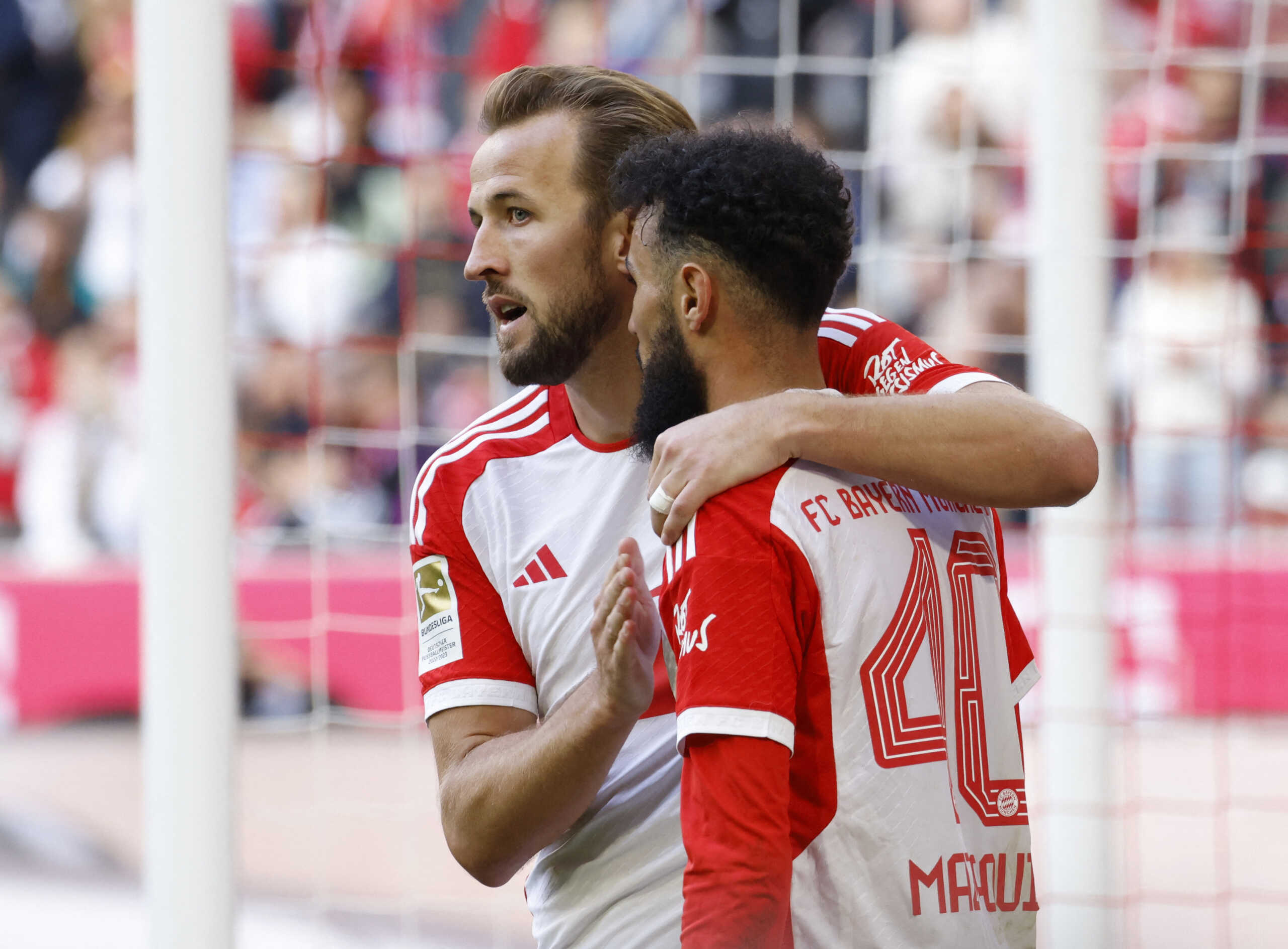 Soccer Football - Bundesliga - Bayern Munich v VfL Bochum - Allianz Arena, Munich, Germany - September 23, 2023 Bayern Munich's Harry Kane celebrates scoring their seventh goal to complete his hat-trick with Noussair Mazraoui REUTERS