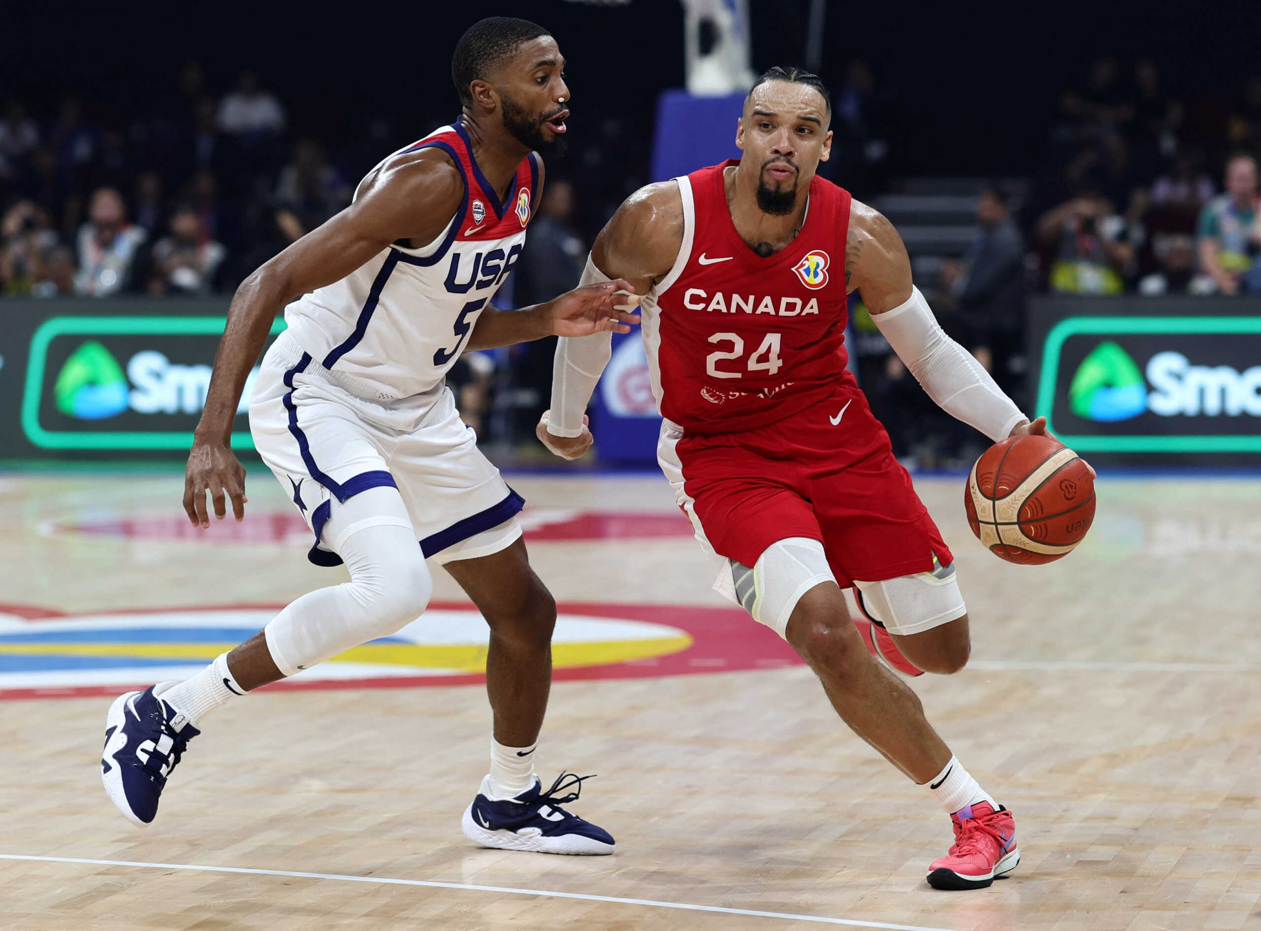 Basketball - FIBA World Cup 2023 - Third-Place Playoff - United States v Canada - Mall of Asia Arena, Manila, Philippines - September 10, 2023 Canada's Dillon Brooks in action with Mikal Bridges of the U.S. REUTERS