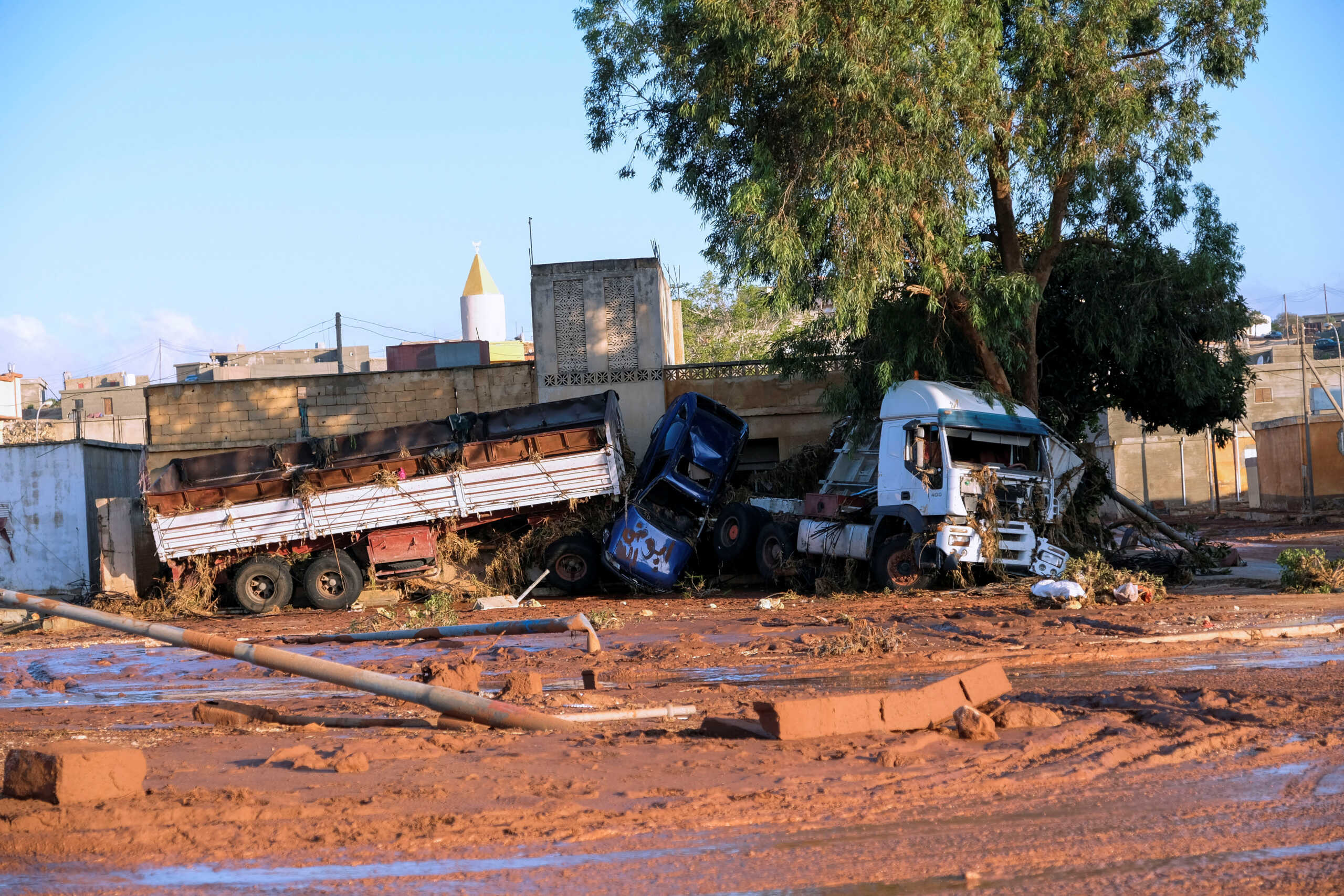 A view shows damaged cars and a truck, after a powerful storm and heavy rainfall hit Libya, in Derna, Libya September 12, 2023. REUTERS