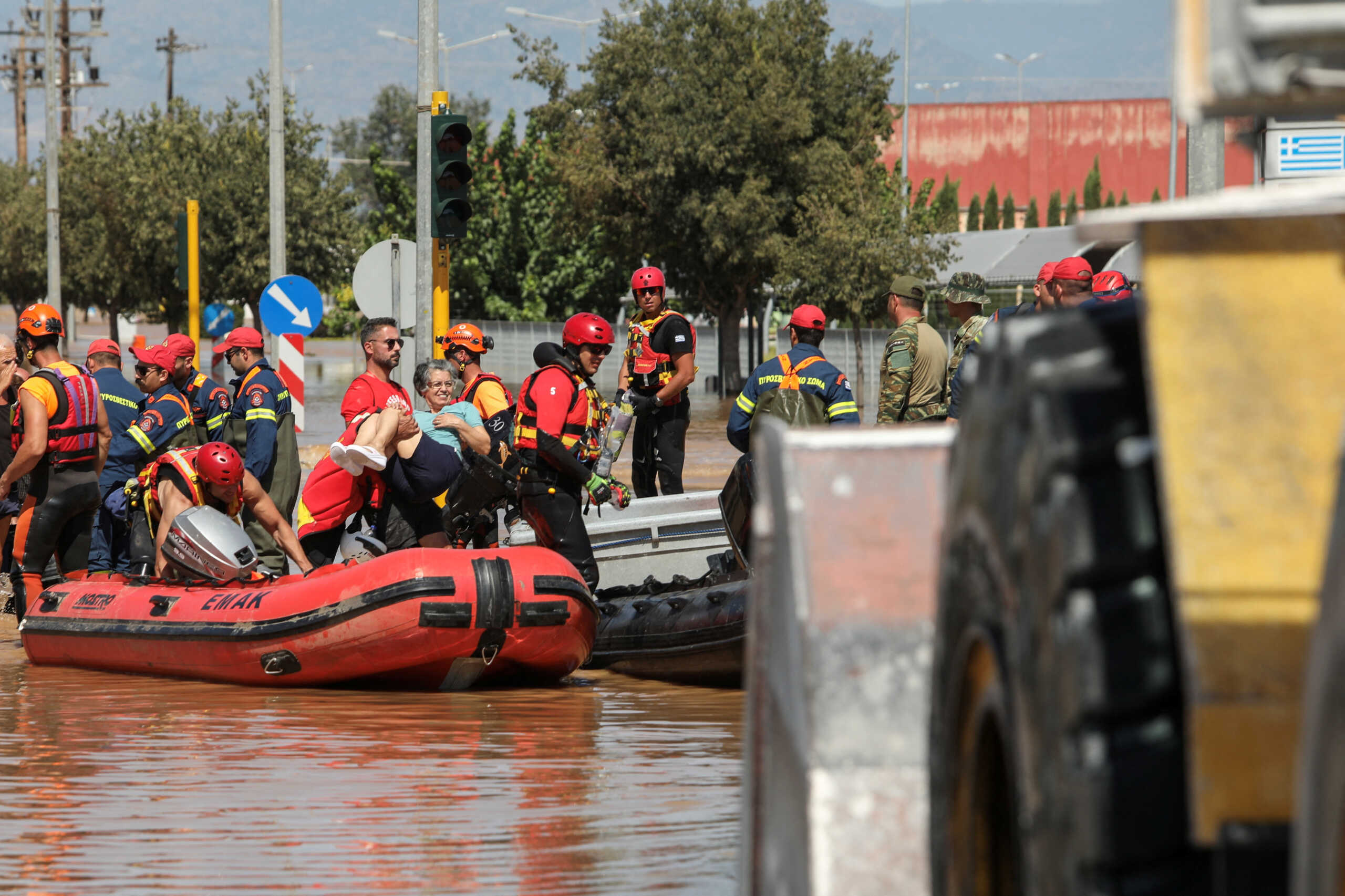 Locals are evacuated on an excavator from a flooded area, in the aftermath of Storm Daniel, in Larissa, Greece, September 10, 2023. REUTERS