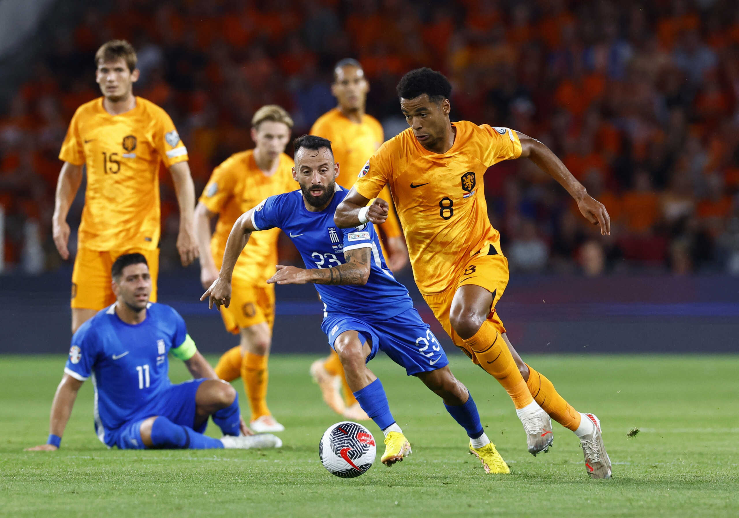 Soccer Football - Euro 2024 Qualifier - Group B - Netherlands v Greece - Philips Stadium, Eindhoven, Netherlands - September 7, 2023 Netherlands' Cody Gakpo in action with Greece's Manolis Siopis REUTERS