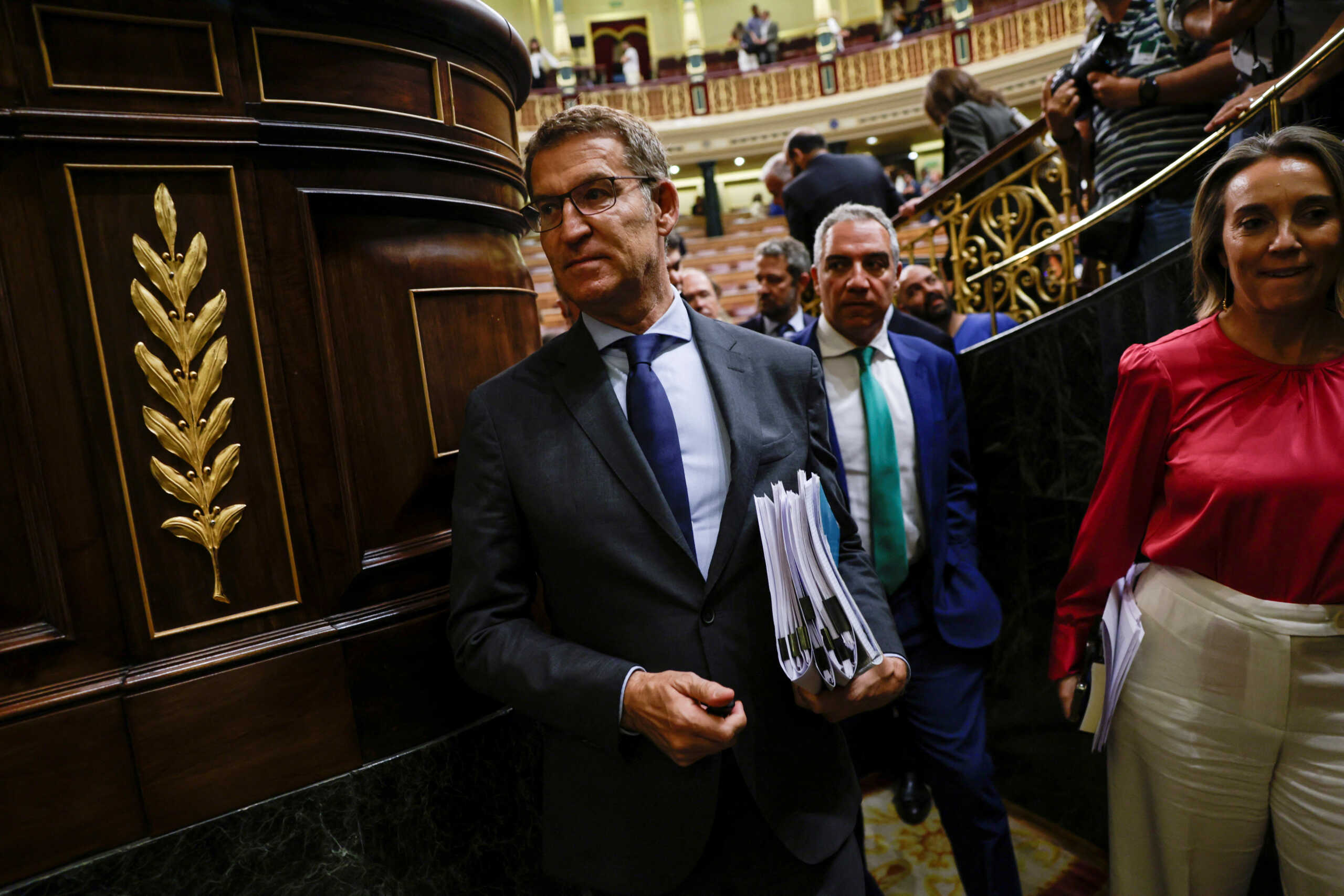 Spain's opposition People's Party leader Alberto Nunez Feijoo leaves after he didn't get enough votes, on the day of the investiture debate in parliament, in Madrid, Spain, September 27, 2023. REUTERS