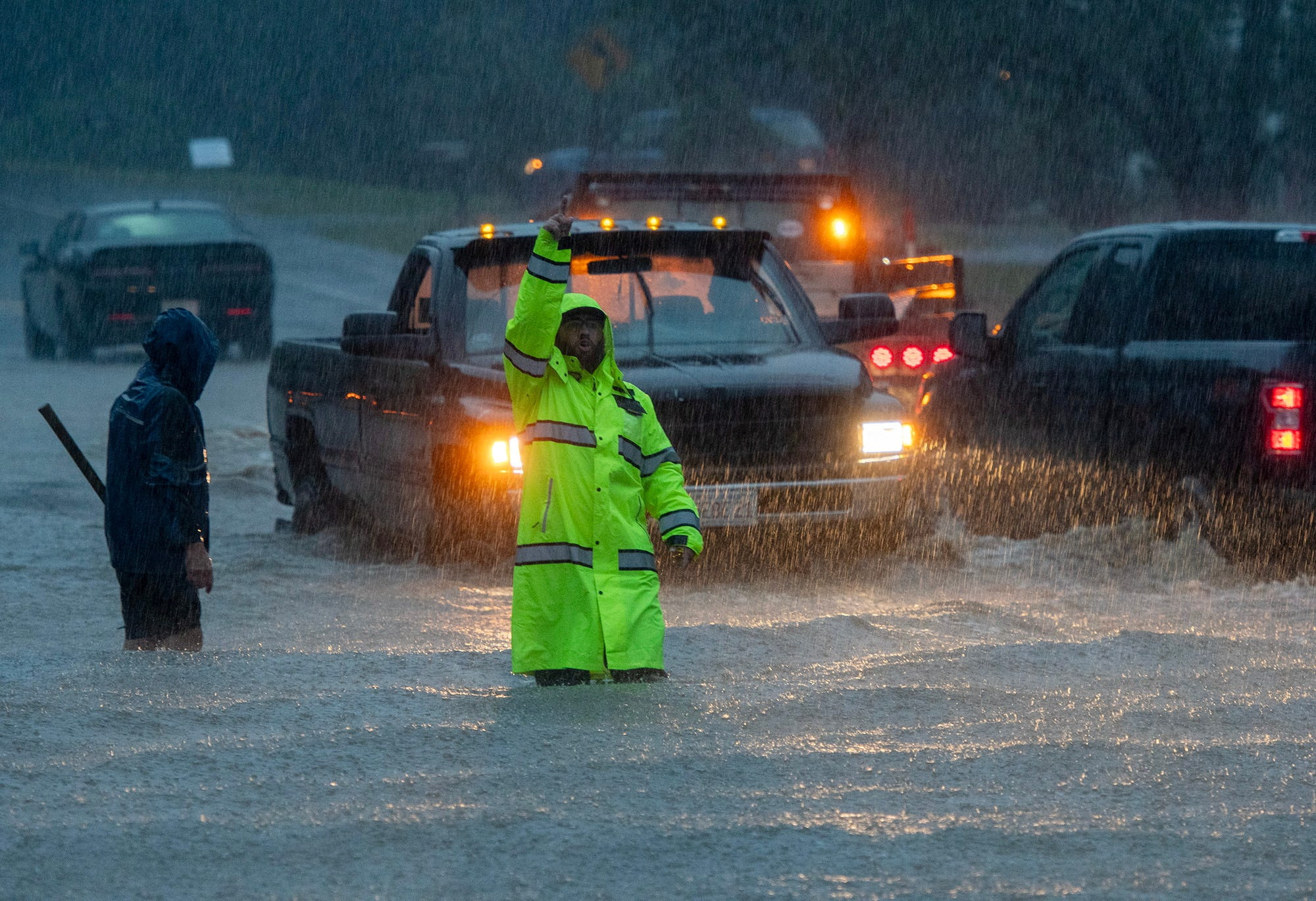 Floodwaters surround vehicles and people after heavy rain in Leominster, Massachusetts, U.S., September 11, 2023. Rick Cinclair