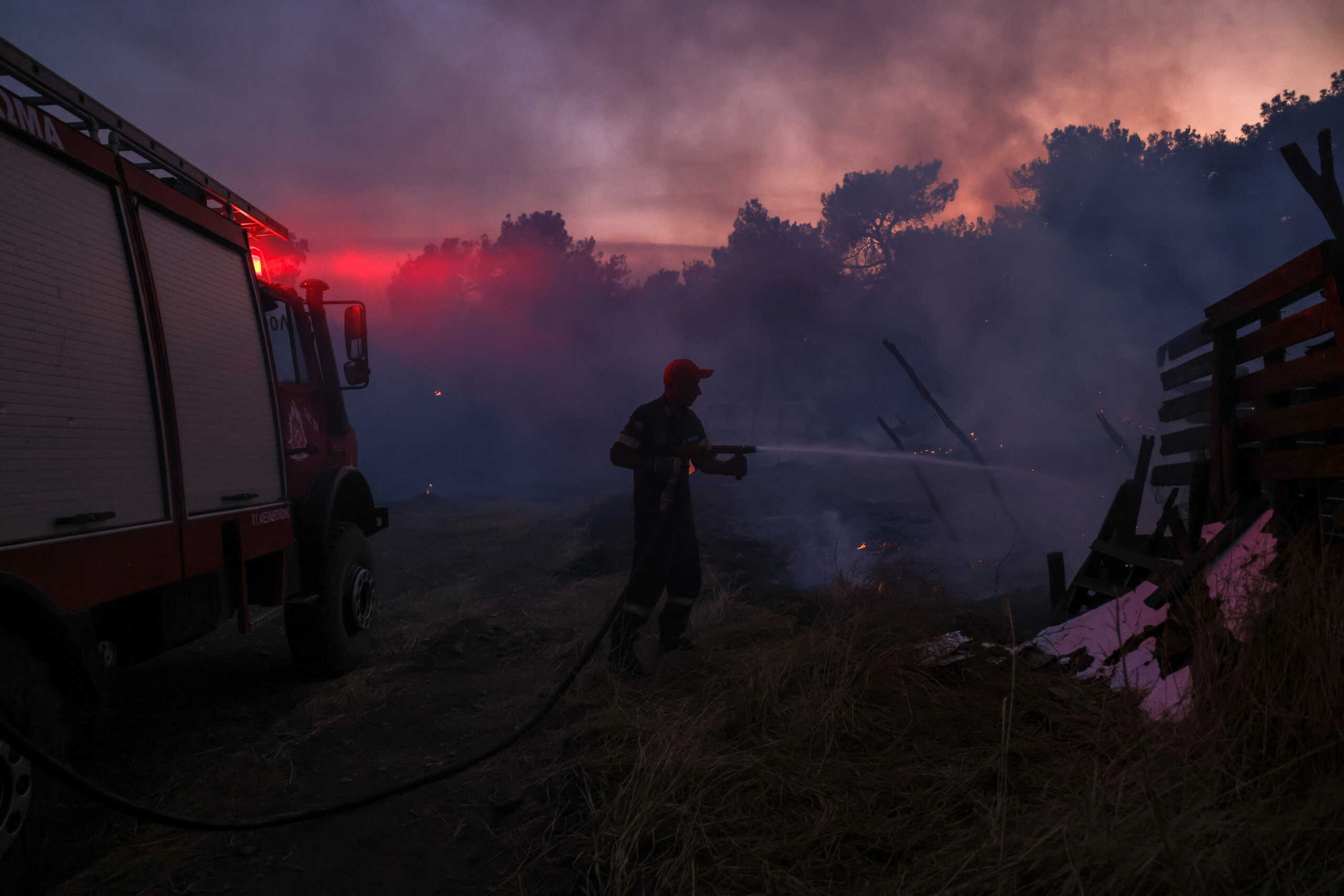 A firefighter tries to extinguish a fire at the sheepfold of Kleanthis Raptis, which was also destroyed in the wildfires of 2022, as a wildfire burns at Dadia National Park in the region of Evros, Greece, September 2, 2023. REUTERS