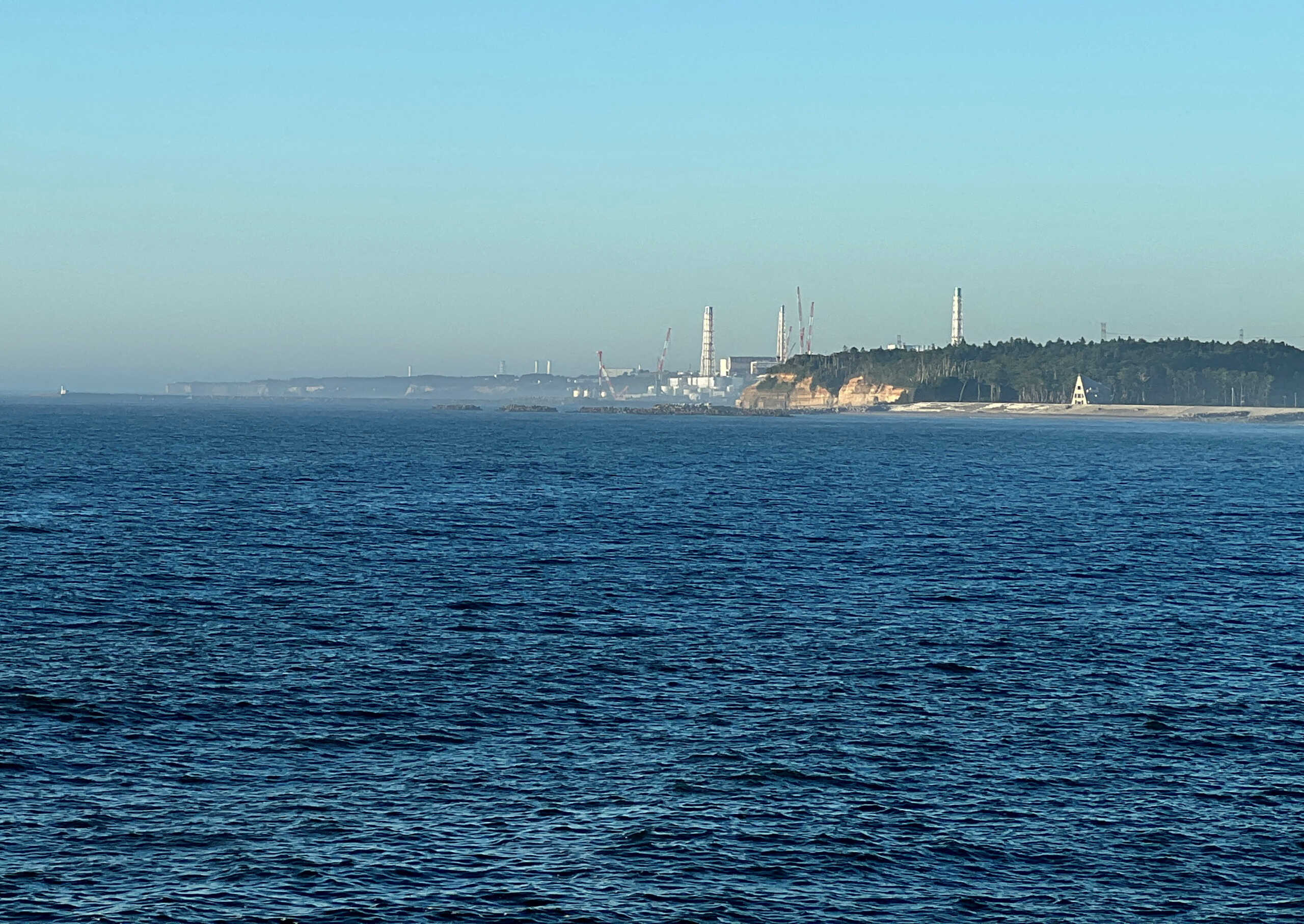 FILE PHOTO: A view of the Fukushima Daiichi nuclear power plant after it started releasing treated radioactive water into the Pacific Ocean, seen from the nearby Ukedo fishing port in Namie town, Fukushima Prefecture, Japan, Aug. 25, 2023. REUTERS