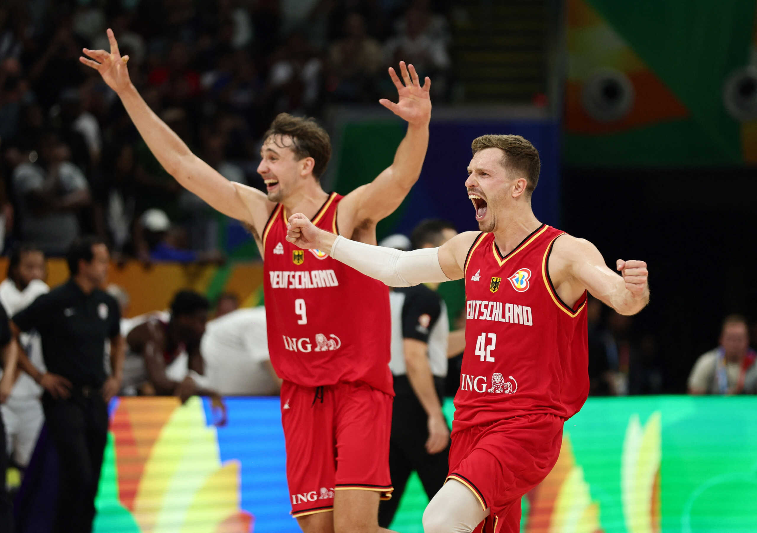 Basketball - FIBA World Cup 2023 - Semi Final - United States v Germany - Mall of Asia Arena, Manila, Philippines - September 8, 2023 Germany's Andreas Obst and Franz Wagner celebrate after the match REUTERS