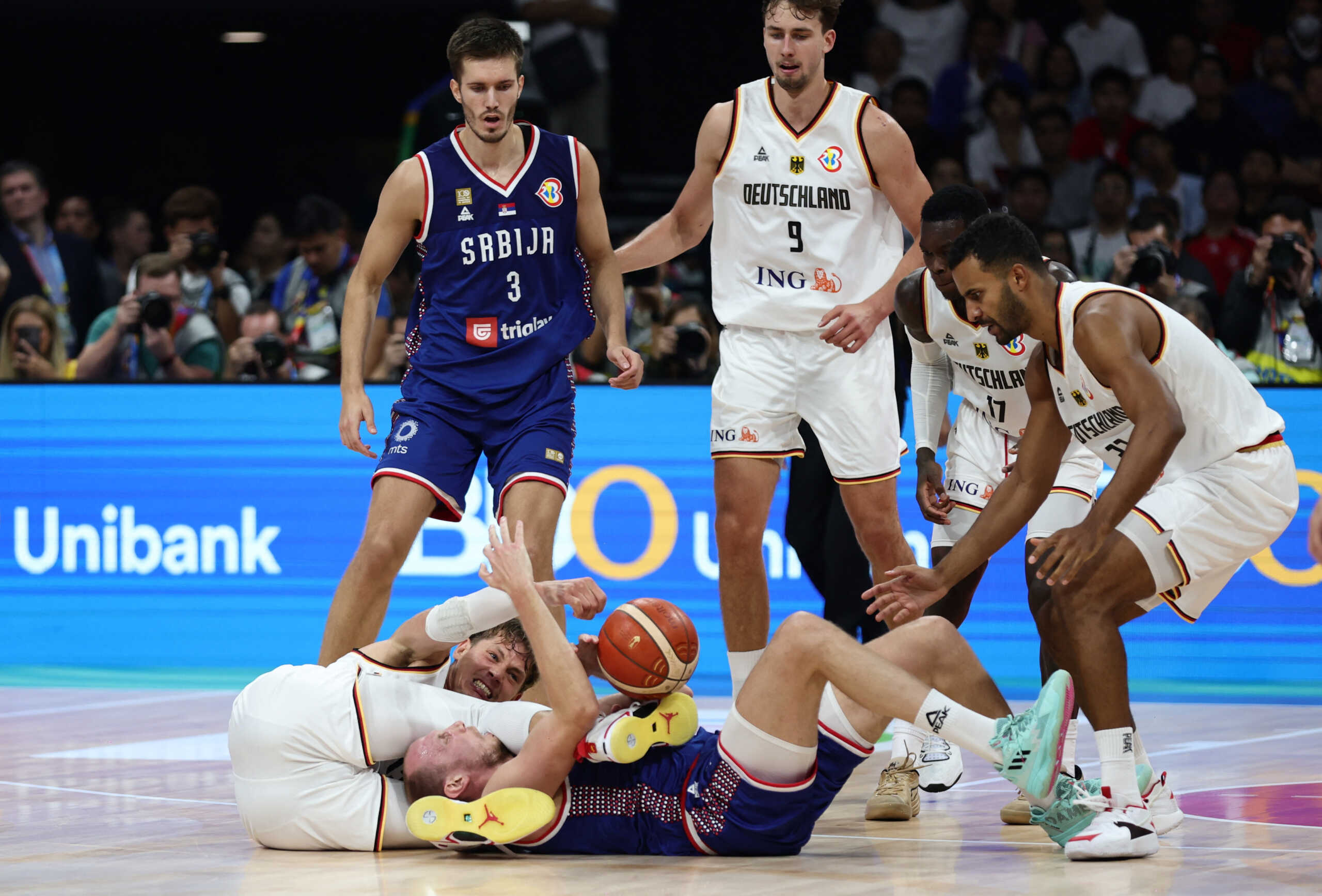 Basketball - FIBA World Cup 2023 - Final - Germany v Serbia - Mall of Asia Arena, Manila, Philippines - September 10, 2023 Serbia's Dejan Davidovac in action with Germany's Moritz Wagner REUTERS