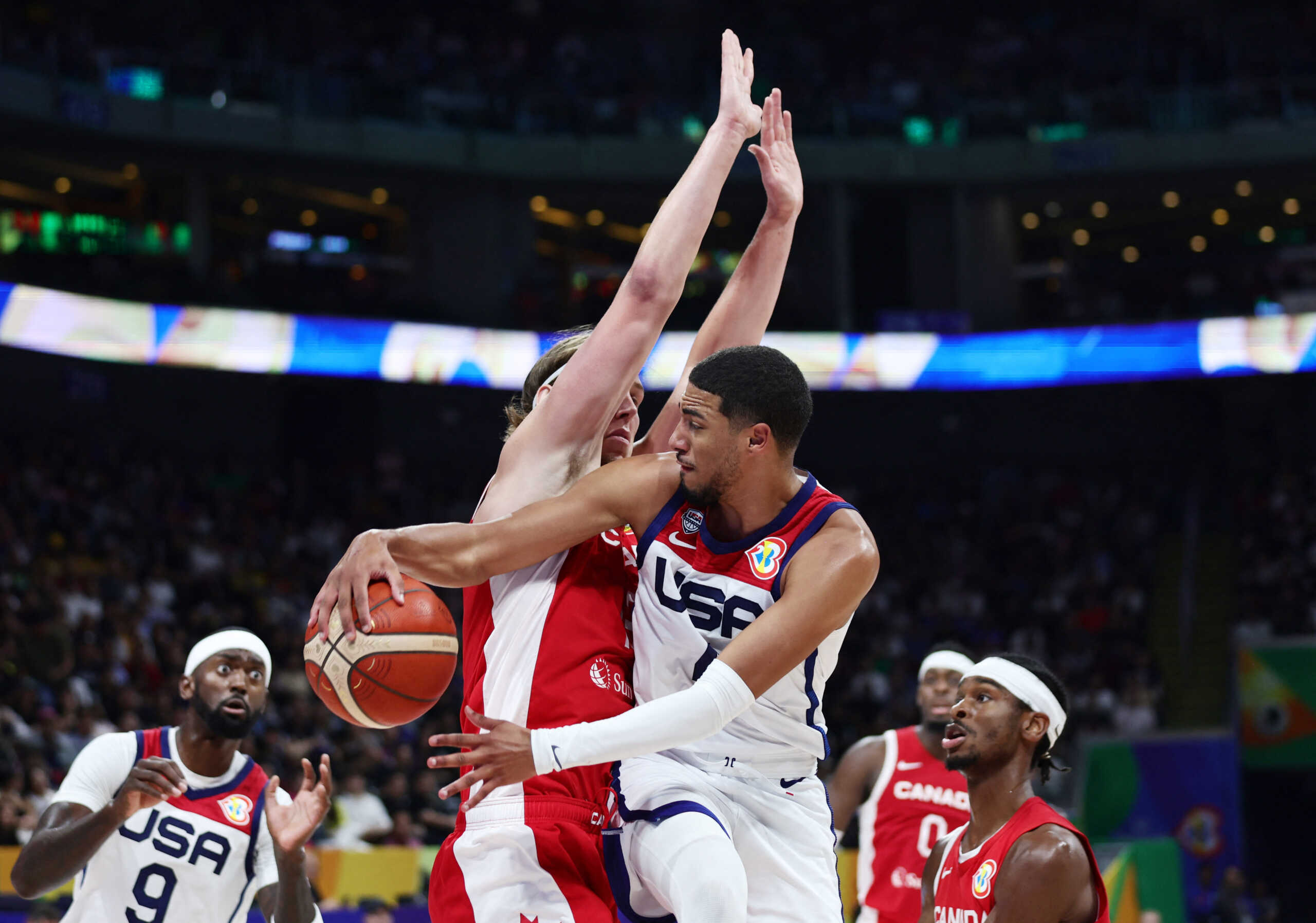 Basketball - FIBA World Cup 2023 - Third-Place Playoff - United States v Canada - Mall of Asia Arena, Manila, Philippines - September 10, 2023 Canada's Kelly Olynyk in action with Tyrese Haliburton of the U.S. REUTERS