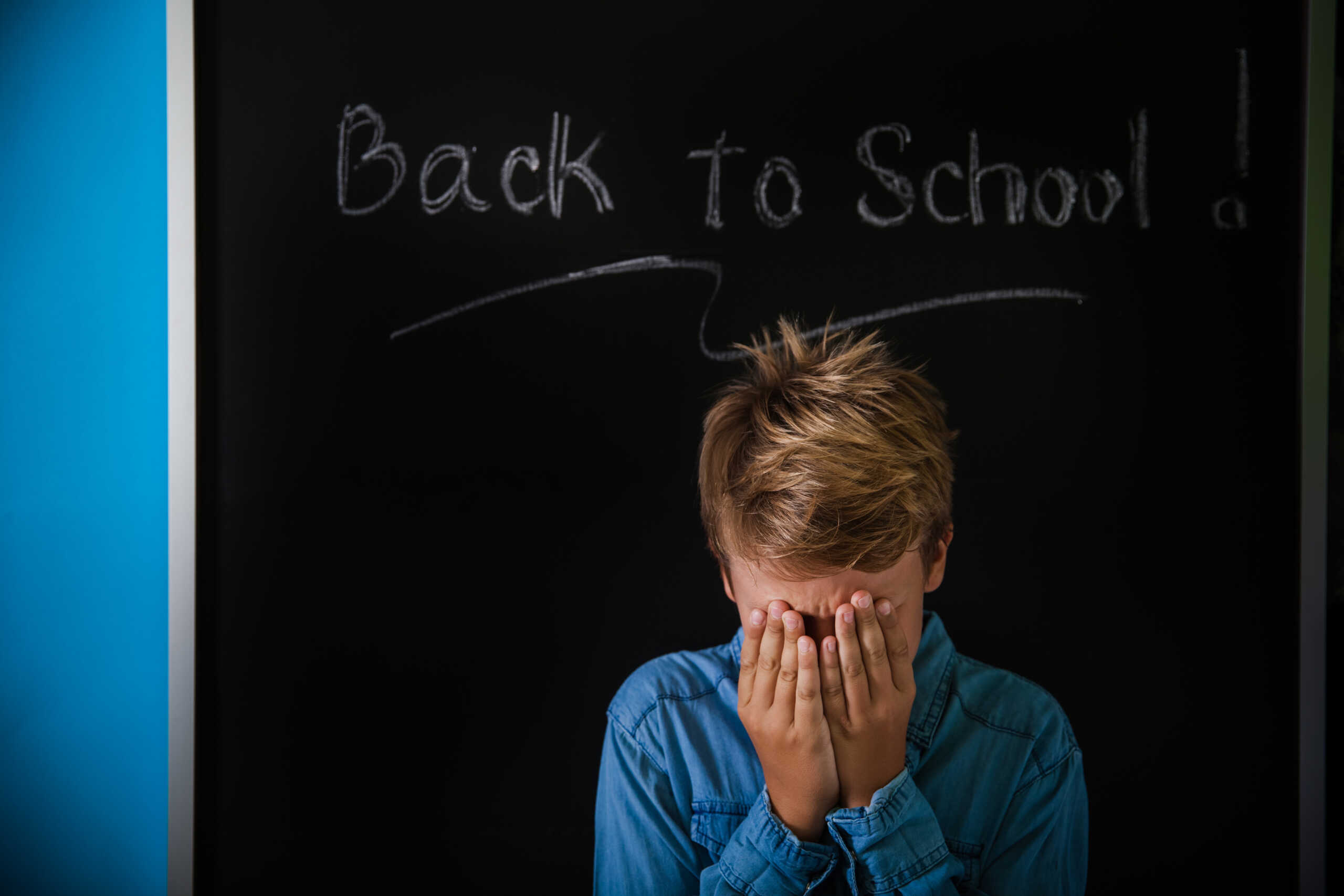 Boy is really unhappy about going back to school after the summer break