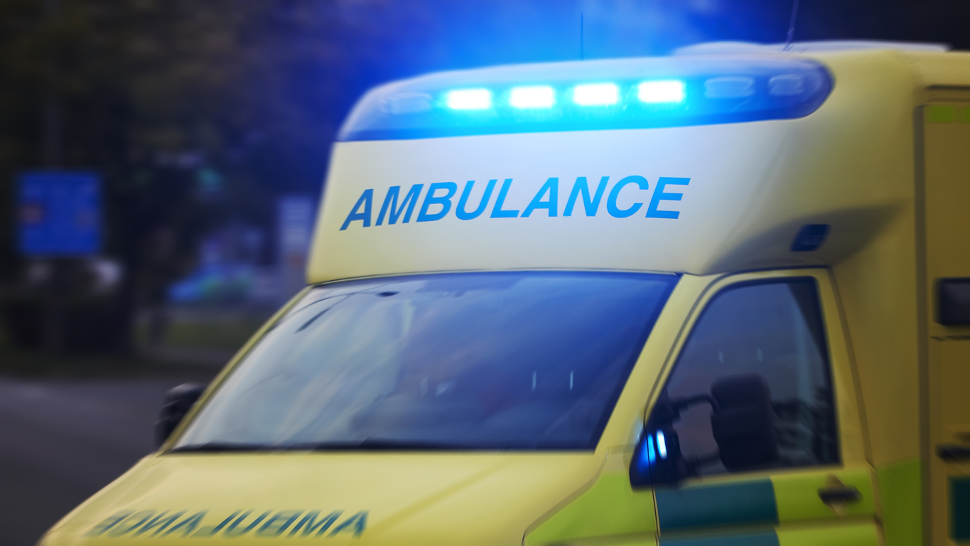 Ambulance car of emergency medical service in blurred motion. Themes rescue, urgency and health care.