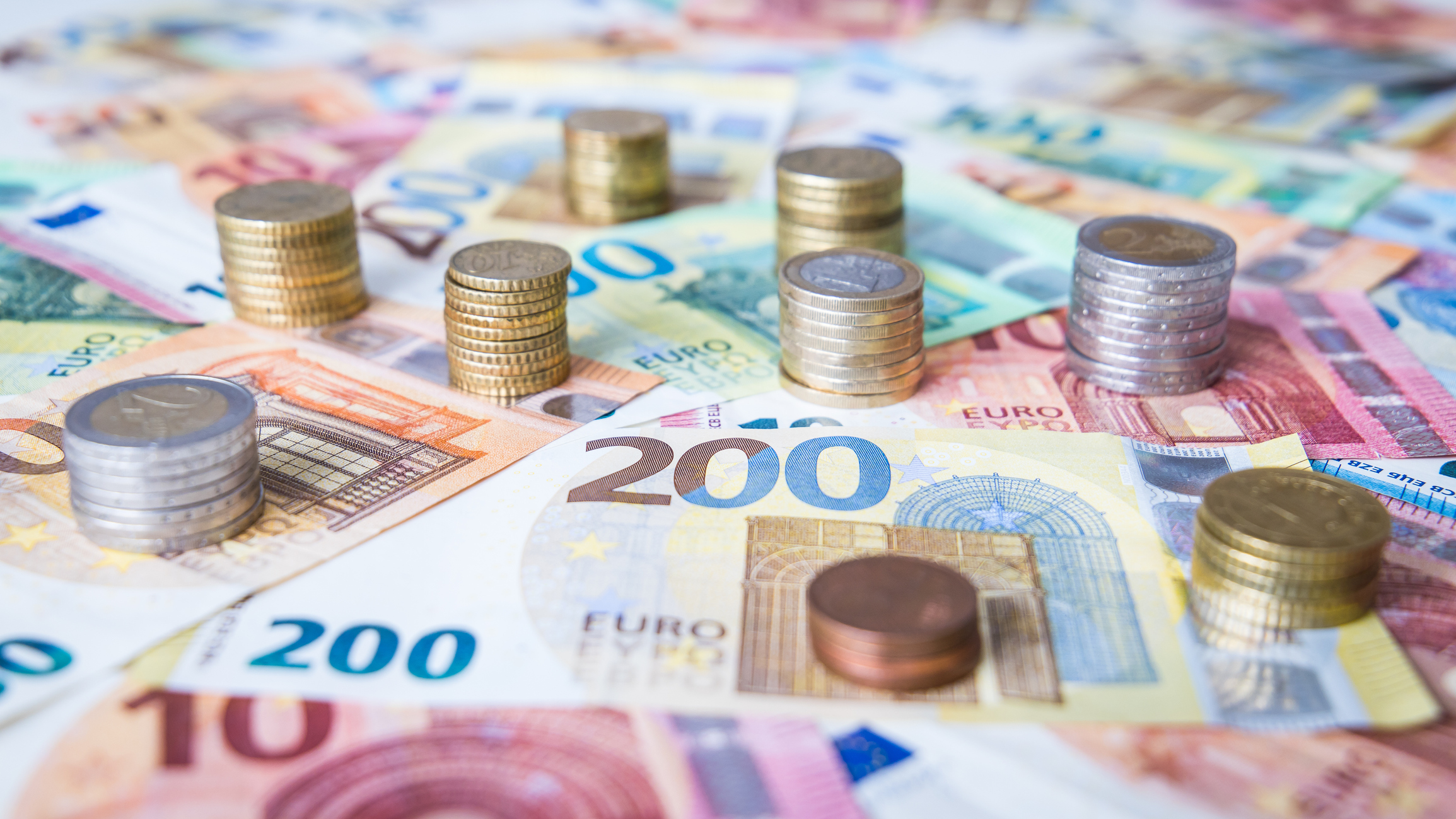 A combination of different Euro banknotes and Euro coins as a closeup