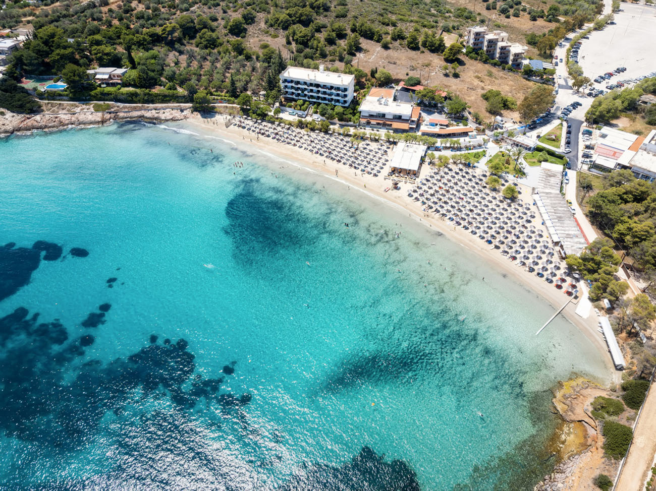 Aerial view of the beautiful bay of Avlaki at Porto Rafti, Attica, Greece, with turquoise sea