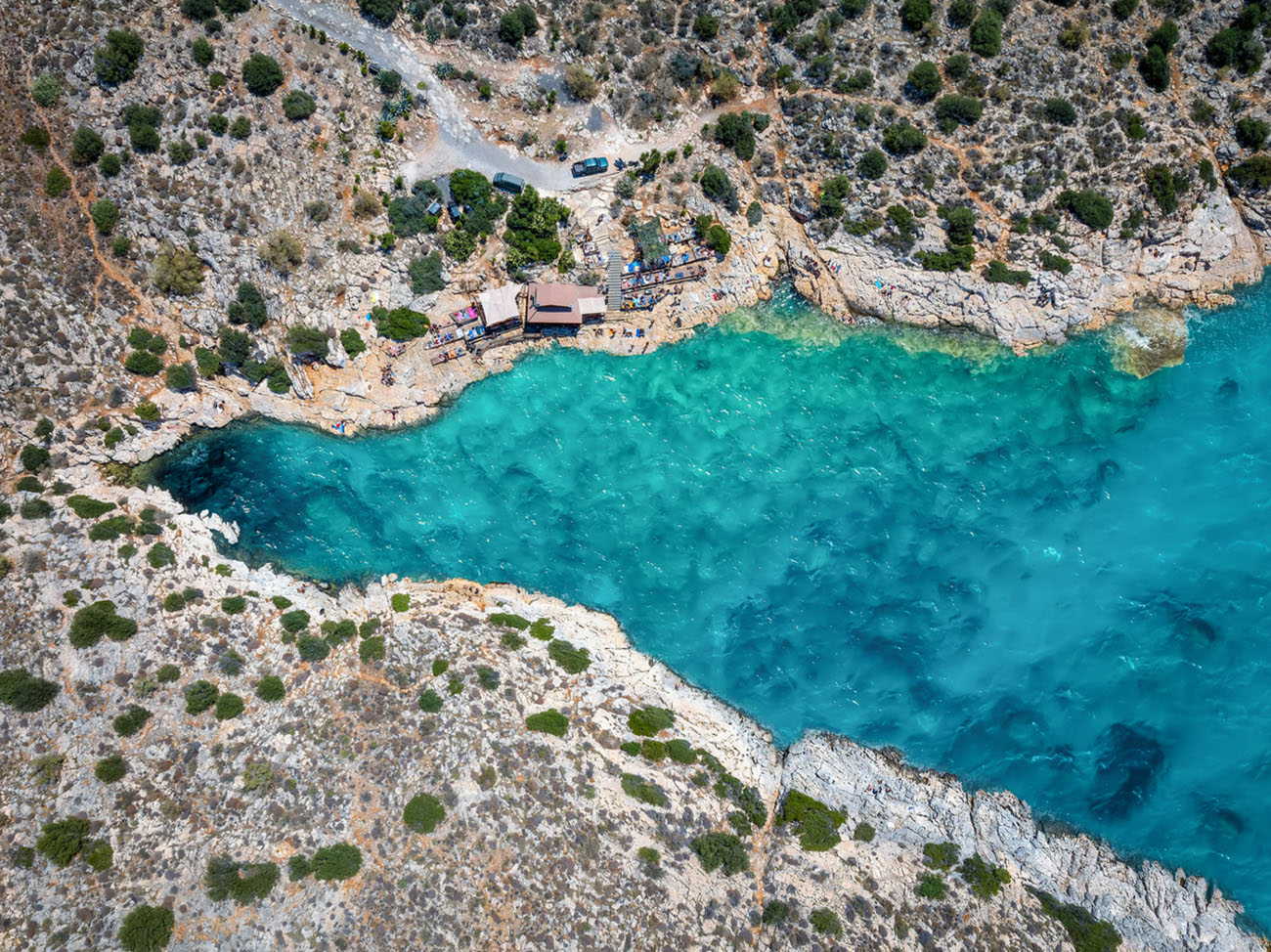 Aerial top view of the beautiful bay at the Limanakia area, Vouliagmeni, Athens, Greece, popular swimming destination for local people