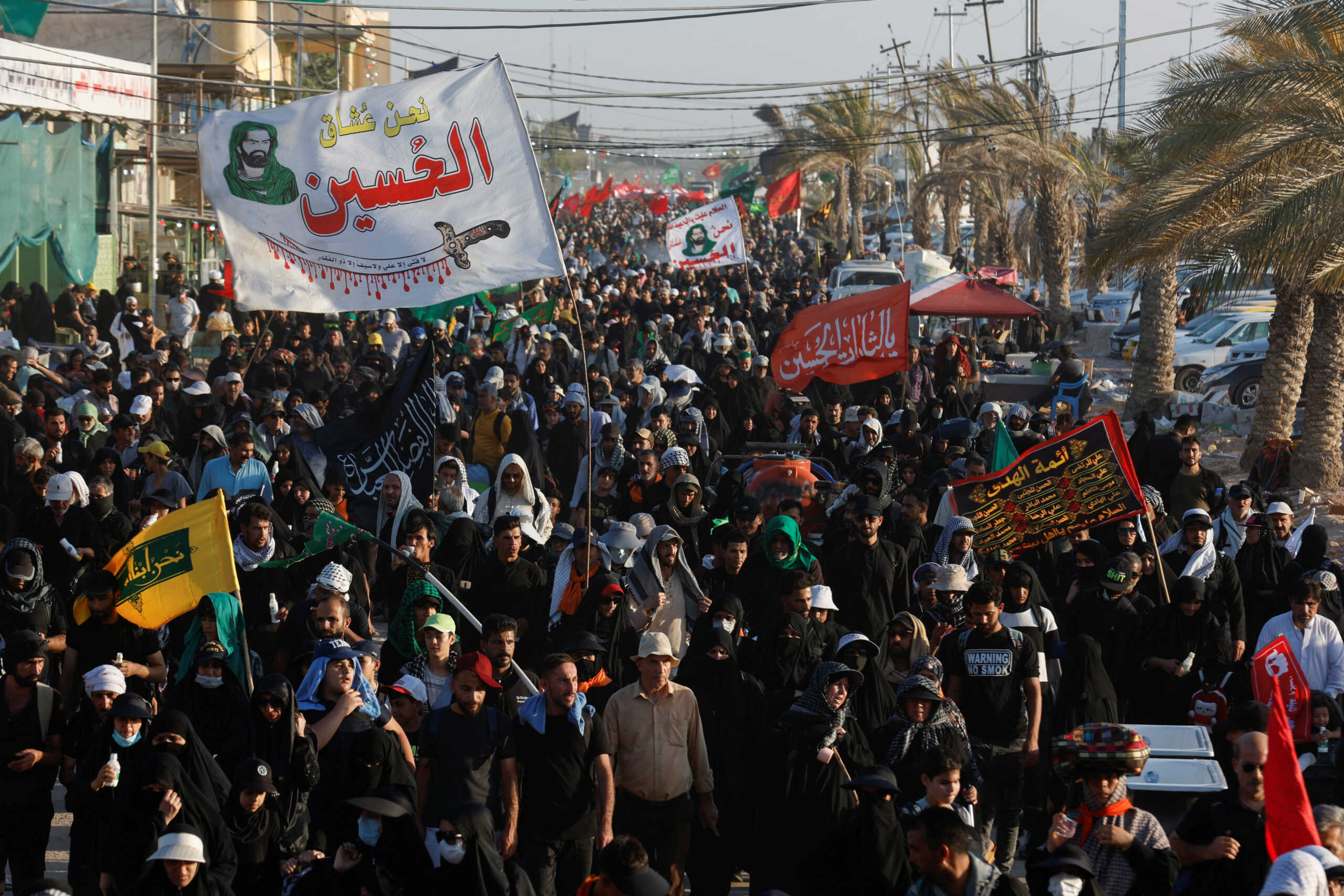 Shi'ite Muslim pilgrims walk to the holy city of Kerbala, ahead of the holy Shi'ite ritual of Arbaeen, in Najaf, Iraq September 2, 2023. REUTERS