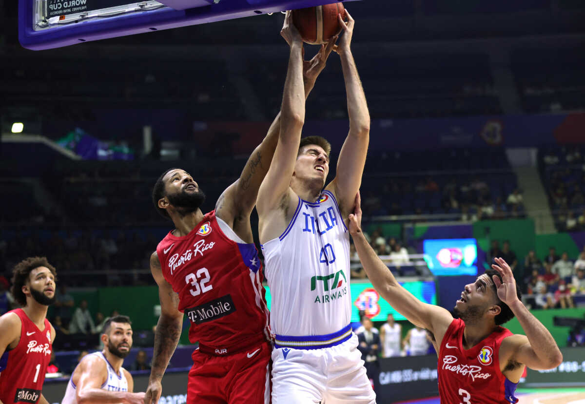 Basketball - FIBA World Cup 2023 - Second Round - Group I - Italy v Puerto Rico - Araneta Coliseum, Quezon, Philippines - September 3, 2023 Italy's Luca Severini in action with Puerto Rico's Christopher Ortiz REUTERS