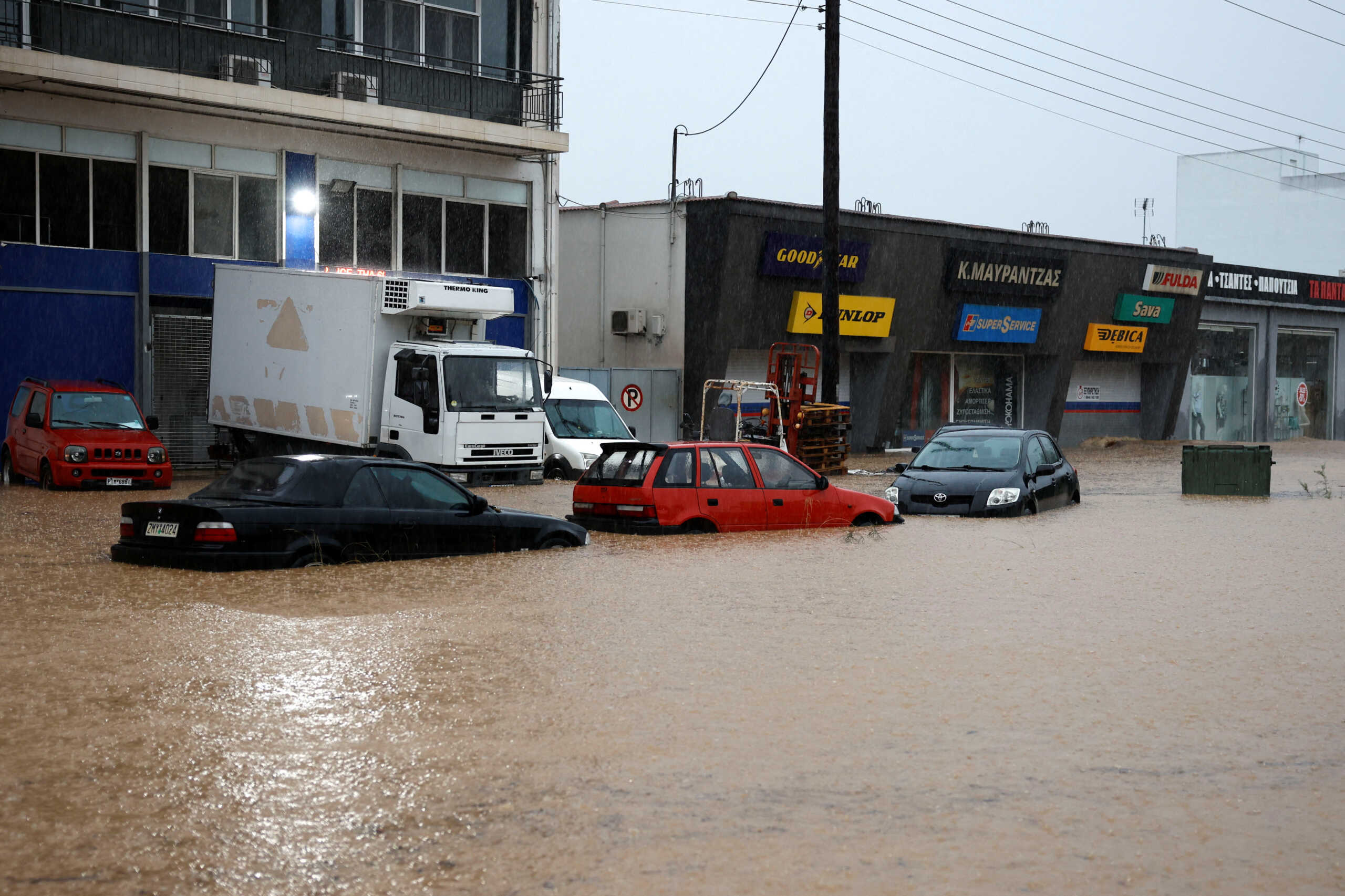 Flooded cars are pictured as the waters of a river rise due the impact of storm "Daniel", in the city of Volos, Greece, September 5, 2023. REUTERS