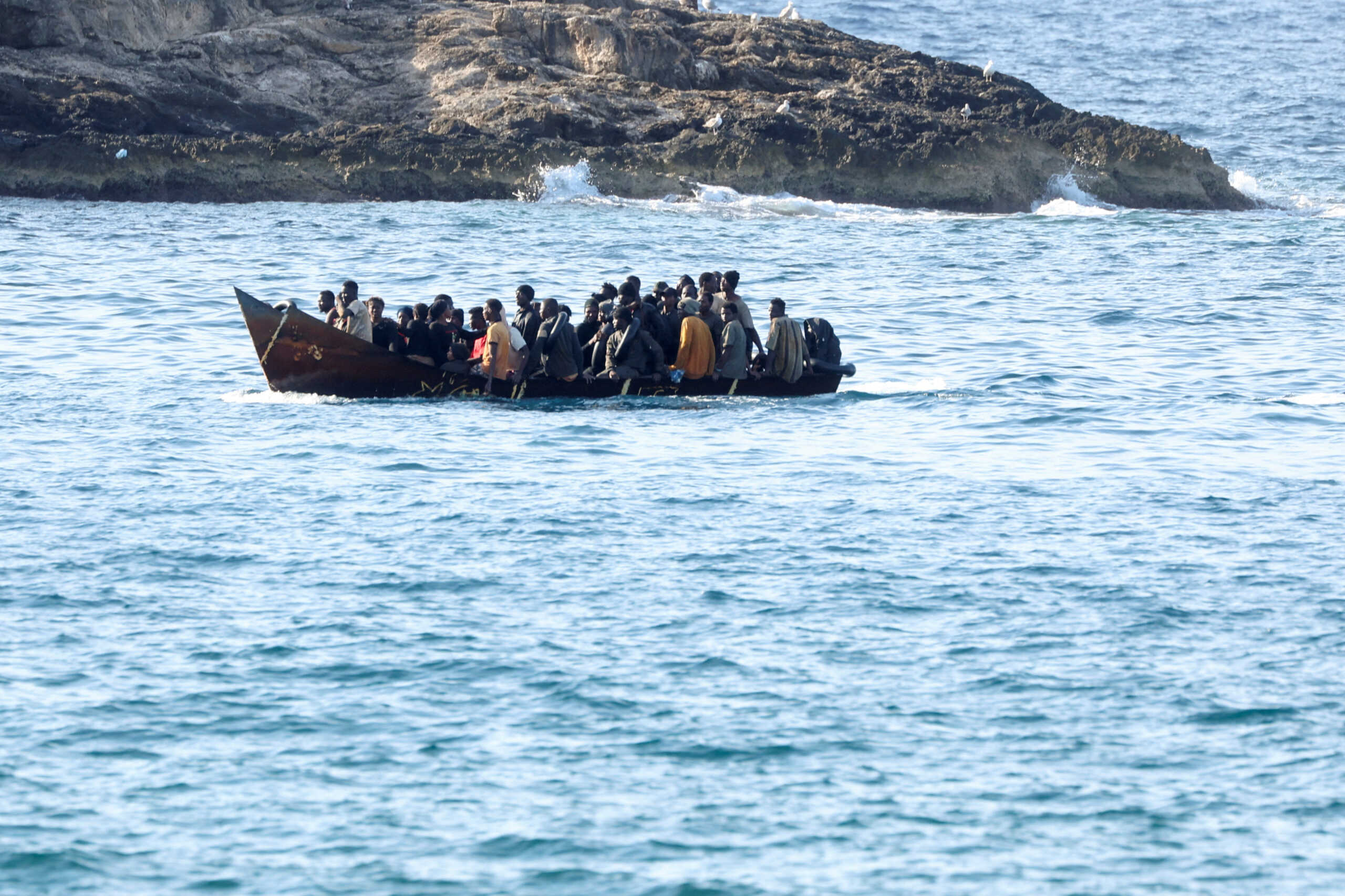 A boat with migrants approaches the Sicilian island of Lampedusa, Italy, September 16, 2023. REUTERS
