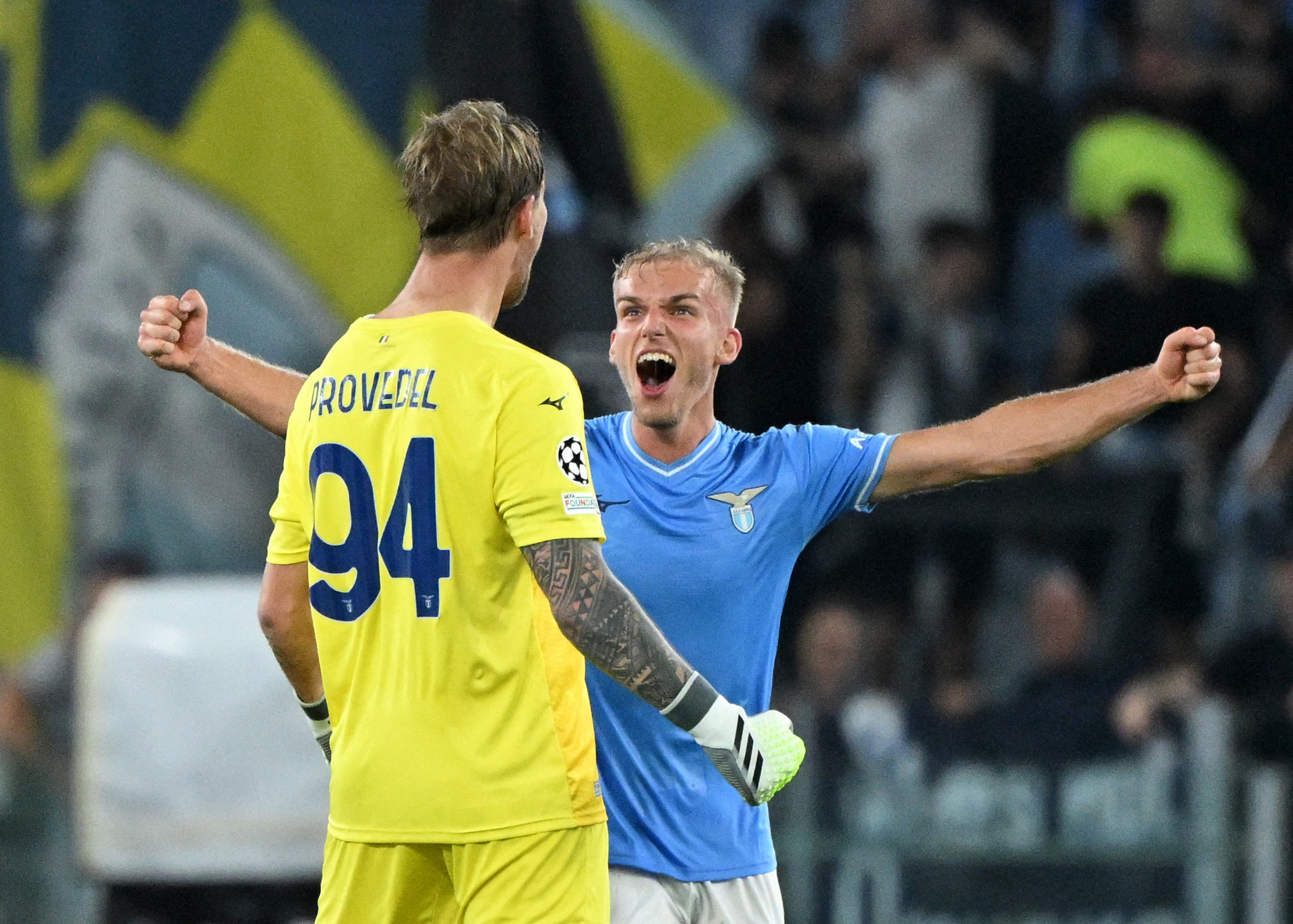Soccer Football - Champions League - Group E - Lazio v Atletico Madrid - Stadio Olimpico, Rome, Italy - September 19, 2023 Lazio's Ivan Provedel celebrates with teammate Gustav Isaksen after the match REUTERS