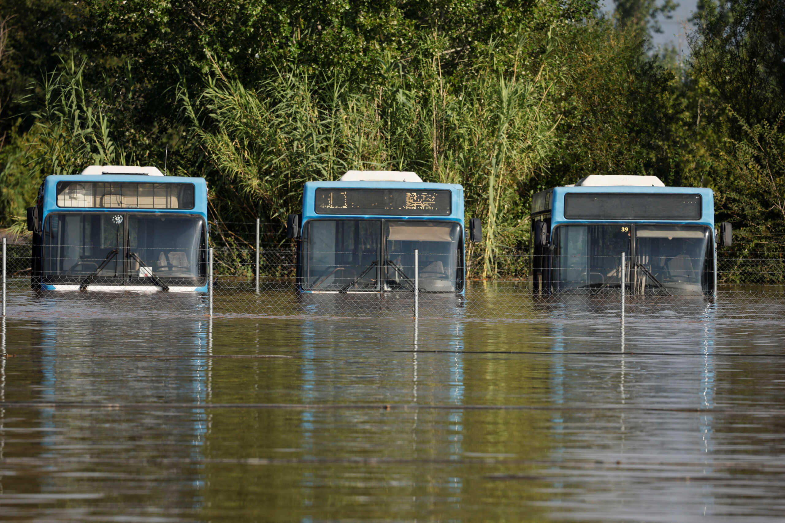 A view of submerged buses, as Pinios river over flooded, after torrential rains in the area, in Larissa, Greece September 8, 2023.  REUTERS