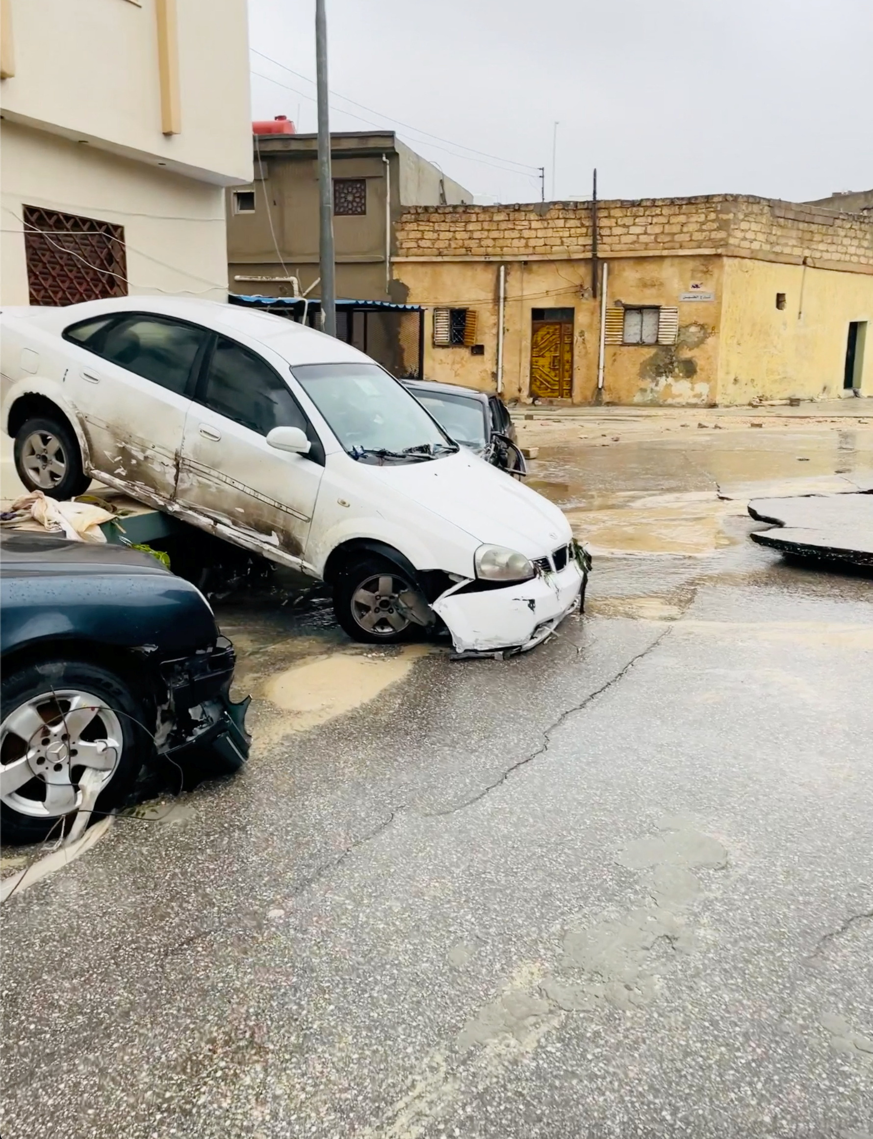 A view shows damaged cars after a powerful storm and heavy rainfall hit, in Al Bayda, Libya, September 11, 2023, in this screengrab obtained from social media video. Instagram