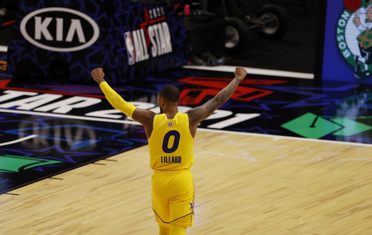 epa09060651 Team LeBron's Damian Lillard celebrates after hitting the game-ending basket against Team Durant in the fourth quarter of the NBA All-Star Game at State Farm Arena in Atlanta, Georgia, USA, 07 March 2021. The NBA All-Star game which is traditionally a weekend-long event has been condensed into a single night this year due to the COVID-19 pandemic.  EPA
