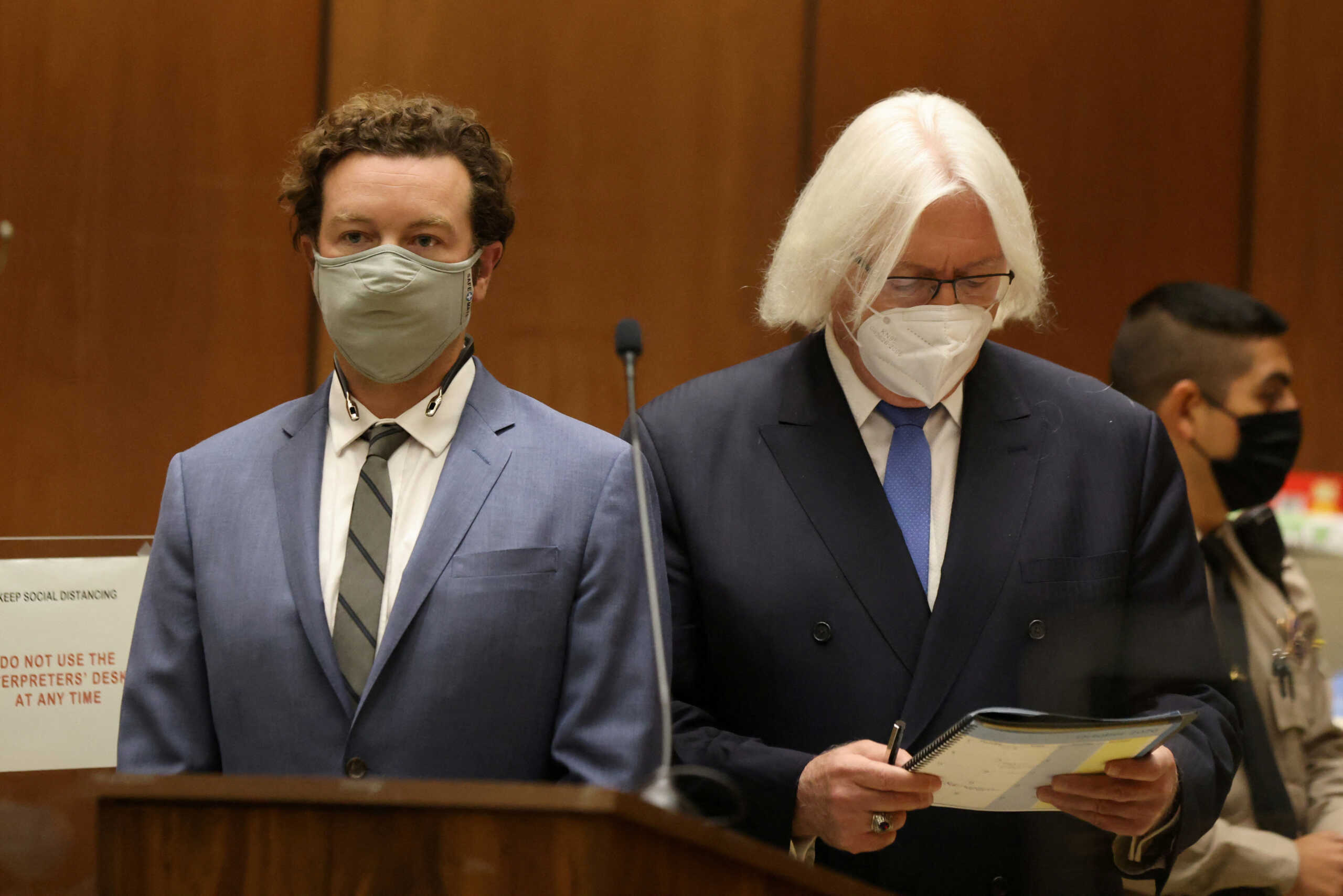 FILE PHOTO: Actor Danny Masterson stands with his lawyer Thomas Mesereau as he is arraigned on three rape charges in separate incidents between 2001 and 2003, at Los Angeles Superior Court, Los Angeles, California, U.S., September 18, 2020. REUTERS
