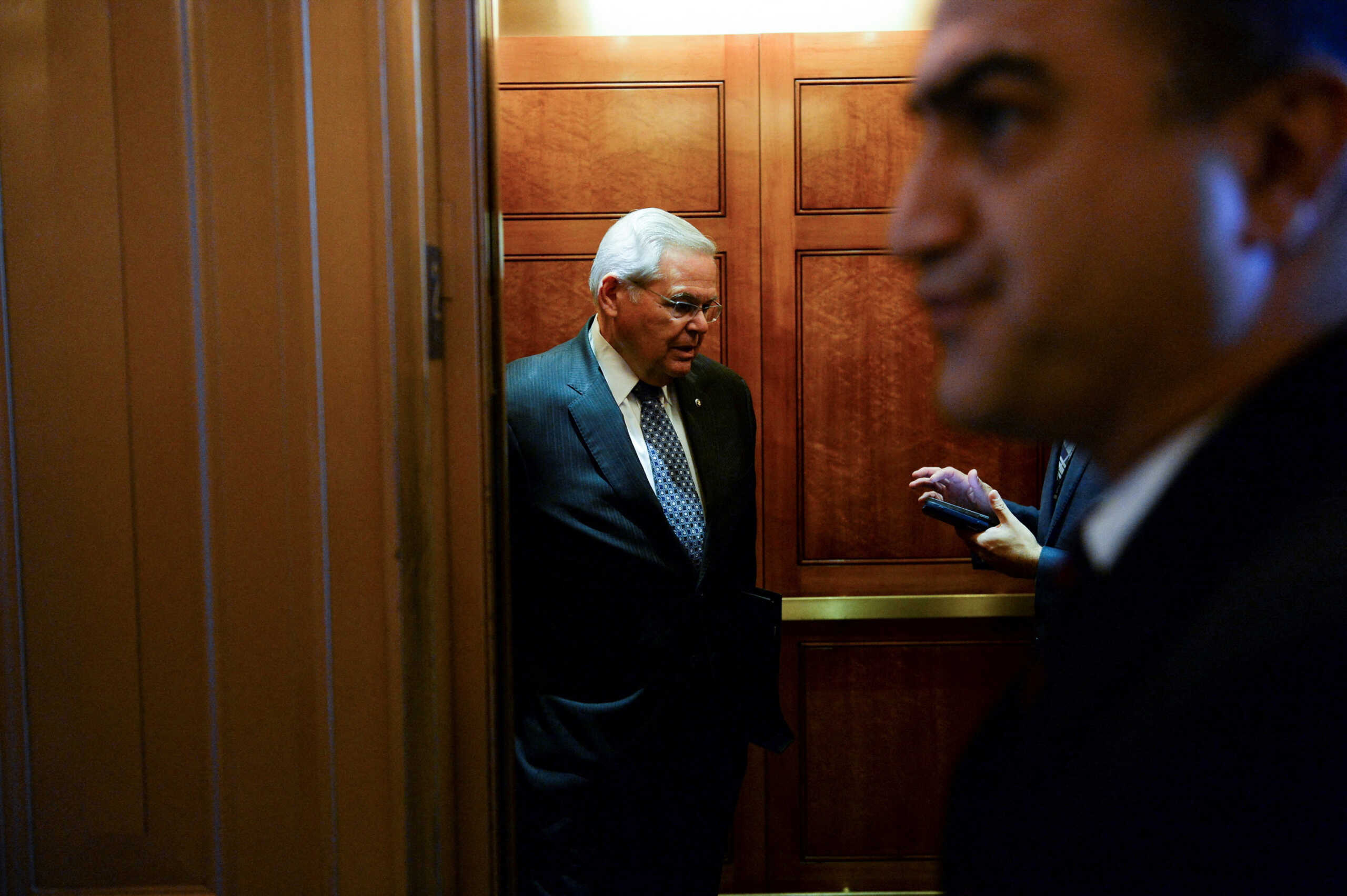FILE PHOTO: Sen. Robert Menendez, (D-NJ) speaks to a reporter in an elevator at the U.S. Capitol in Washington, U.S., September 28, 2022.      REUTERS