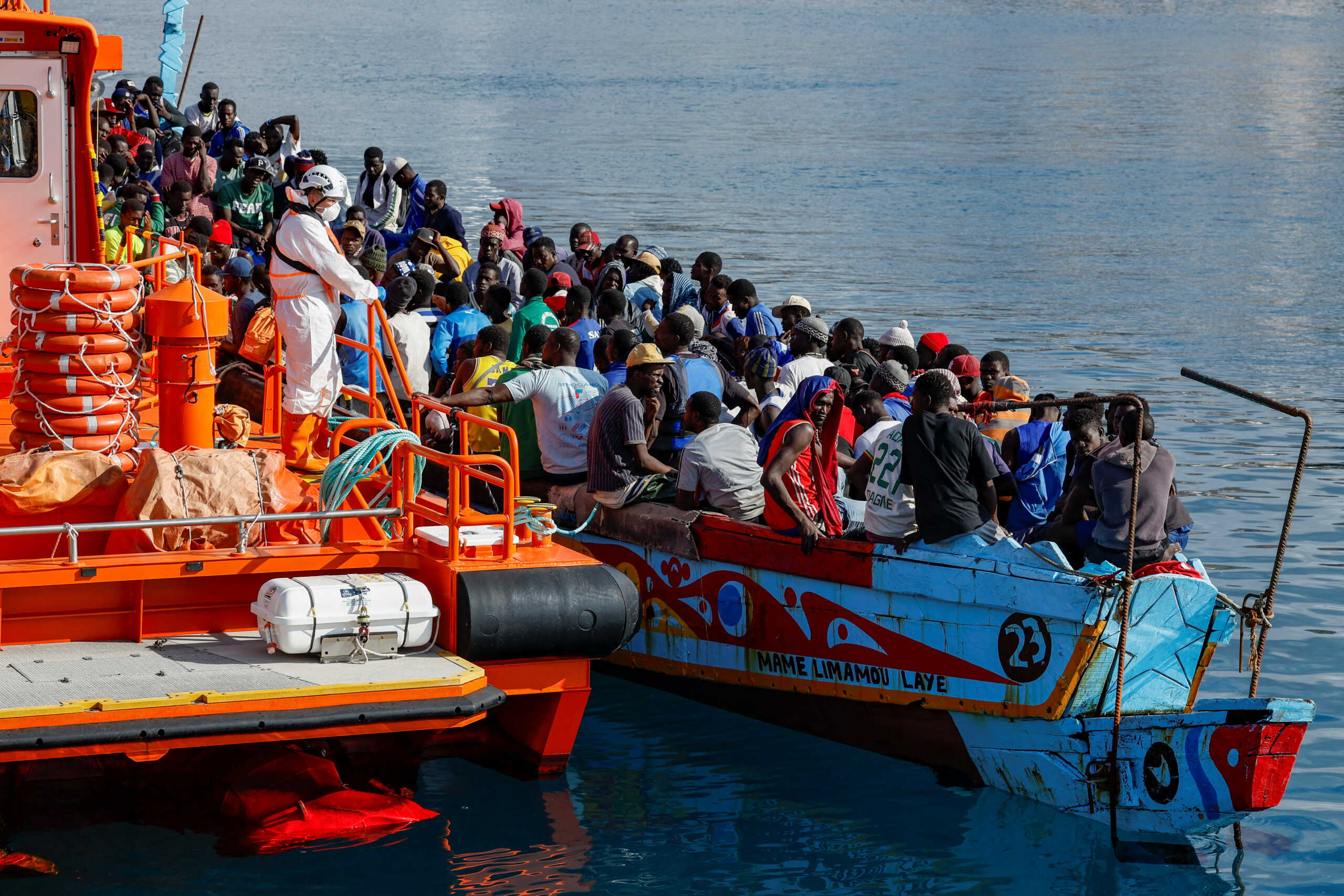 Migrants wait to disembark from a Spanish coast guard vessel, in the port of Arguineguin, in the island of Gran Canaria, Spain, September 4, 2023. REUTERS