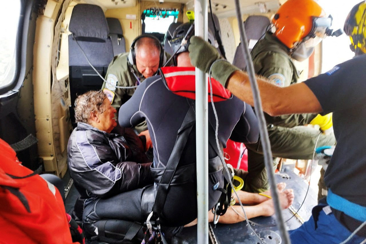 A woman reacts after being evacuated on a helicopter, as storm Daniel hits central Greece, in the village of Agia Triada, near Karditsa, Greece, September 7, 2023. Greek Prime Minister's Office