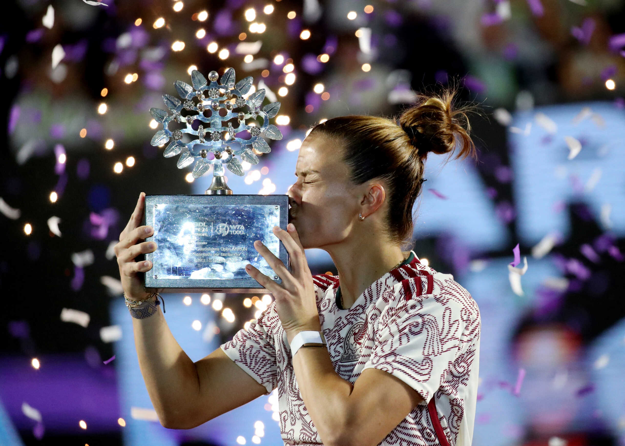 Tennis - WTA 1000 - Guadalajara Open - Panamerican Tennis Center, Guadalajara, Mexico - September 23, 2023 Greece's Maria Sakkari celebrates with the trophy after winning her final match against Caroline Dolehide of the U.S. REUTERS