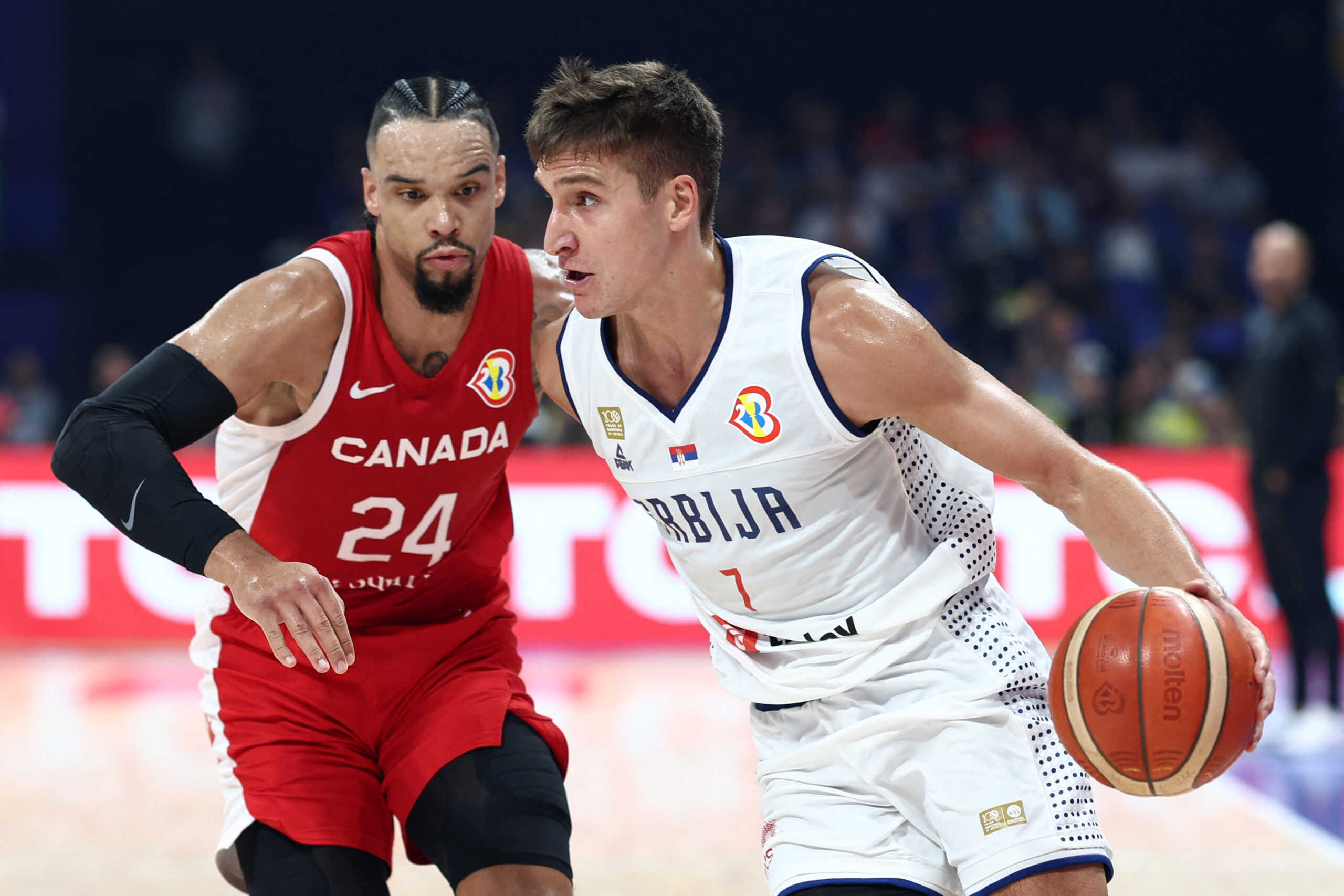 Basketball - FIBA World Cup 2023 - Semi Final - Serbia v Canada - Mall of Asia Arena, Manila, Philippines - September 8, 2023 Serbia's Bogdan Bogdanovic in action with Canada's Dillon Brooks REUTERS