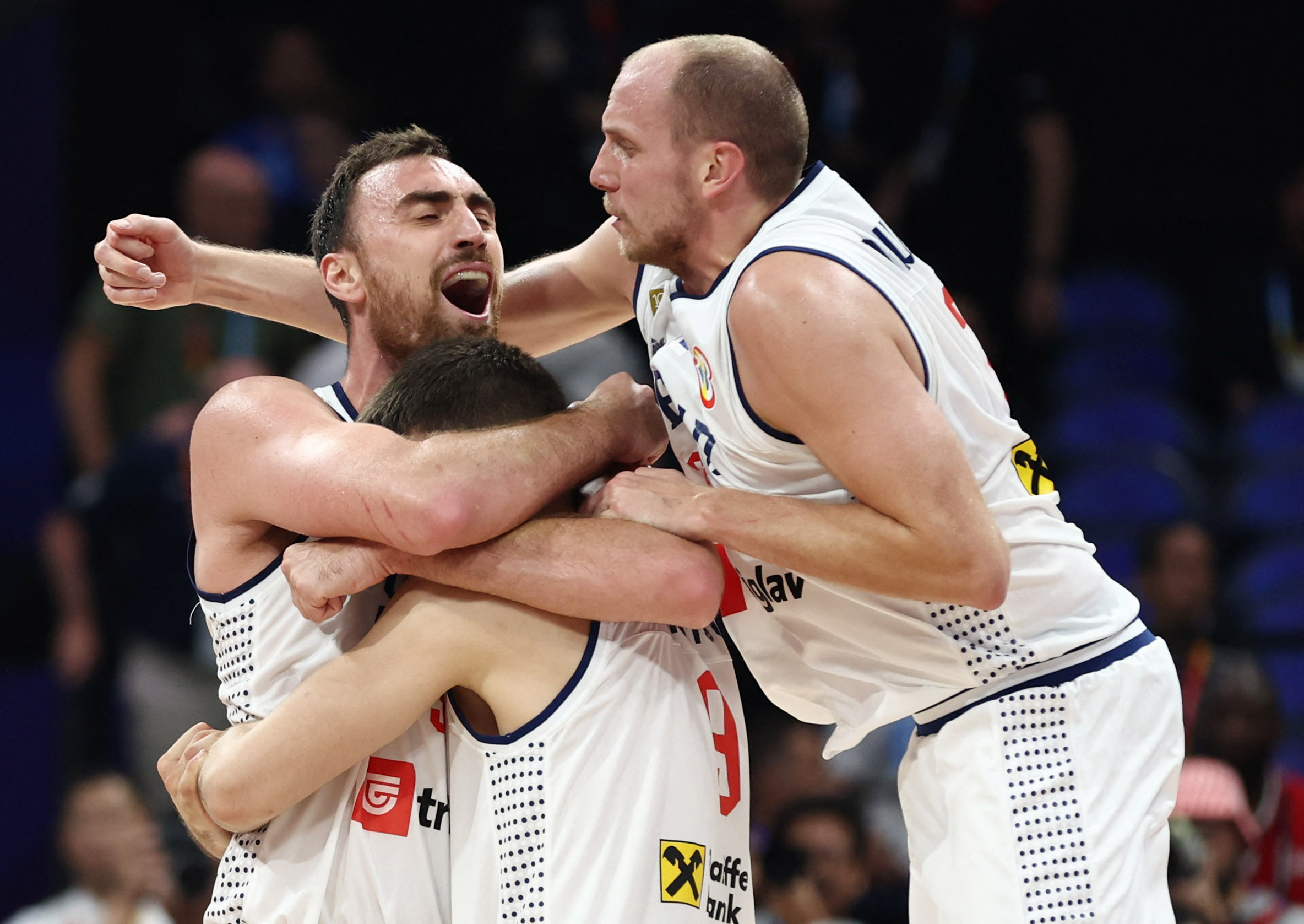 Basketball - FIBA World Cup 2023 - Semi Final - Serbia v Canada - Mall of Asia Arena, Manila, Philippines - September 8, 2023 Serbia's Nikola Milutinov celebrates with teammates after winning the match REUTERS