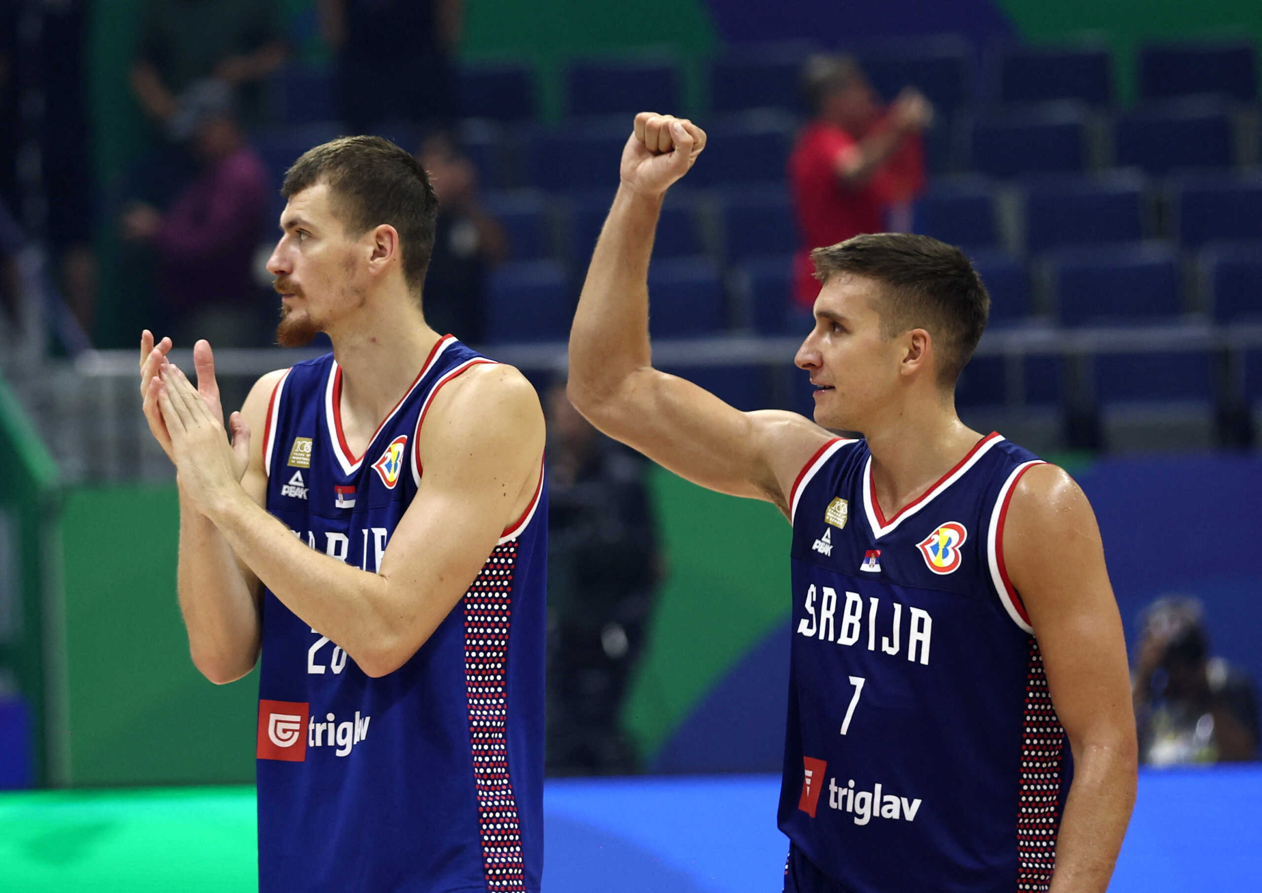 Basketball - FIBA World Cup 2023 - First Round - Group B - Puerto Rico v Serbia - Araneta Coliseum, Quezon, Philippines - August 28, 2023 Serbia's Borisa Simanic celebrates with Serbia's Bogdan Bogdanovic after winning the match REUTERS