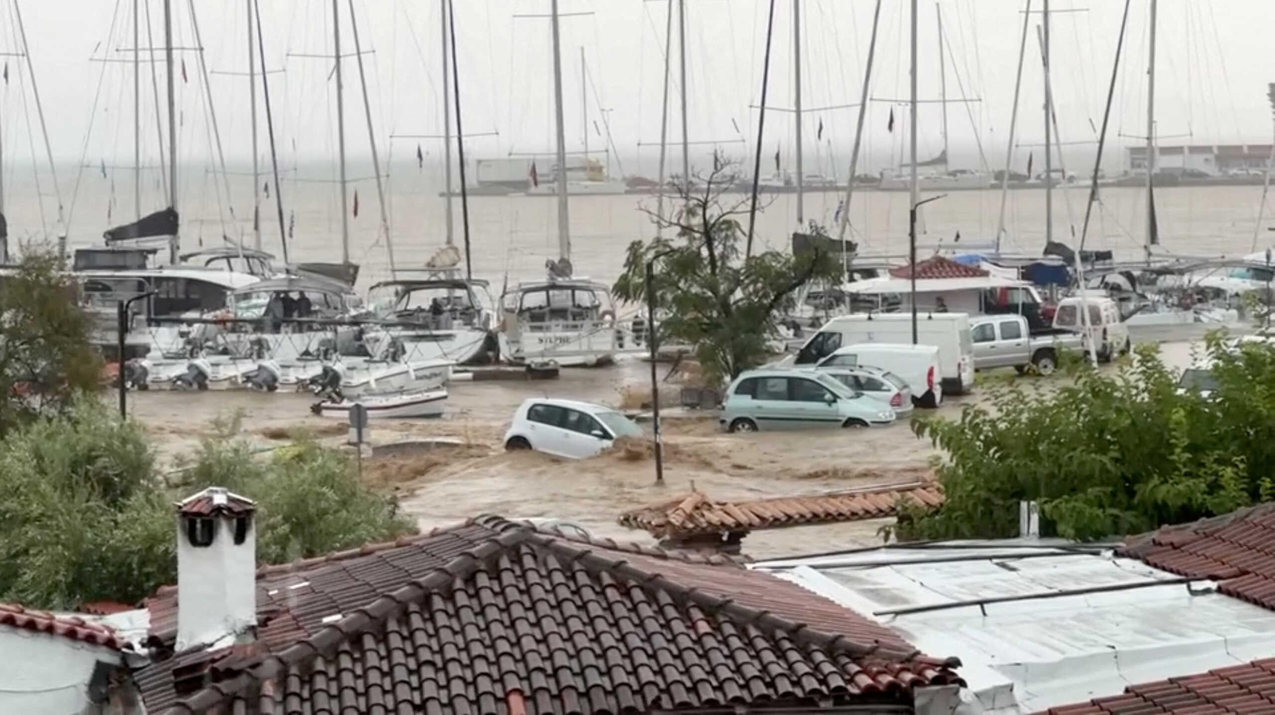 Partially submerged cars are seen in a flooded road due to the impact of storm Daniel in Skiathos, Greece, September 5, 2023 in this screengrab obtained from a social media video. @hzikas via X
