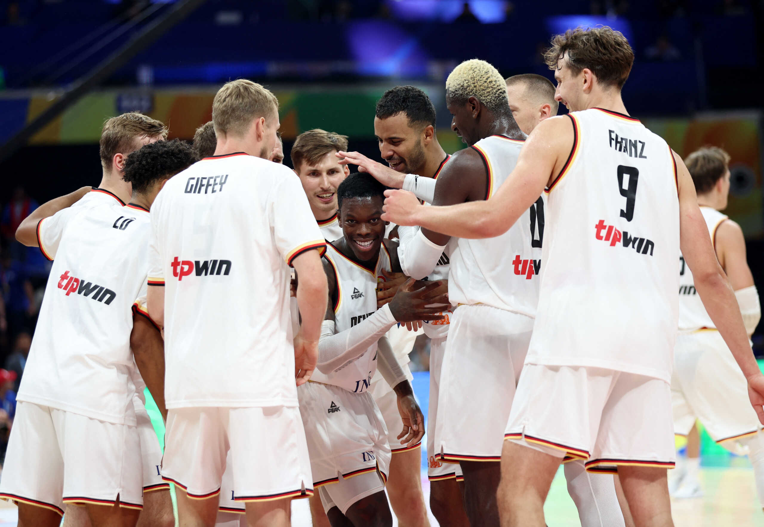 Basketball - FIBA World Cup 2023 - Quarter-Final - Germany v Latvia - Mall of Asia Arena, Manila, Philippines - September 6, 2023 Germany's Dennis Schroder celebrates with teammates after winning the match REUTERS