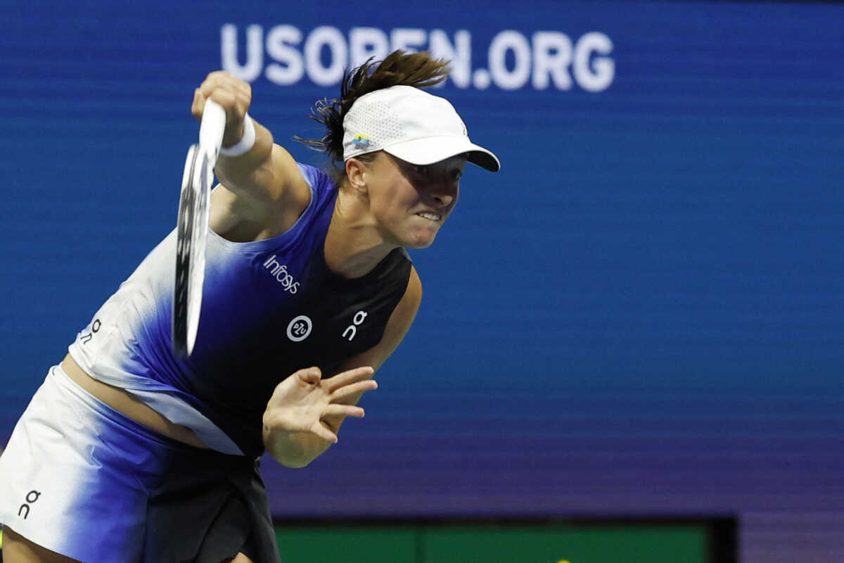Sep 3, 2023; Flushing, NY, USA; Iga Swiatek of Poland serves against Jelena Ostapenko of Latvia (not pictured) on day seven of the 2023 U.S. Open tennis tournament at USTA Billie Jean King National Tennis Center. Mandatory Credit: Geoff Burke-USA TODAY Sports