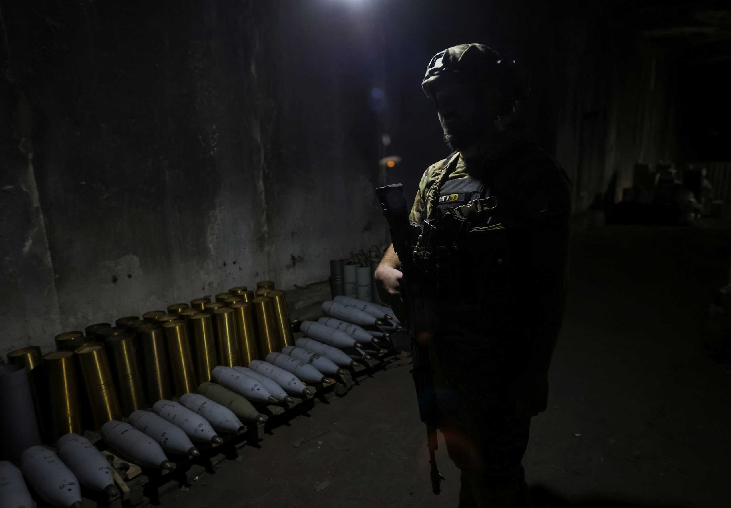 A Ukrainian serviceman of the Spartan Brigade of the National Guard of Ukraine stands in a shelter near artillery shells at a front line, amid Russia's attack on Ukraine, in Zaporizhzhia region, Ukraine September 13, 2023. REUTERS