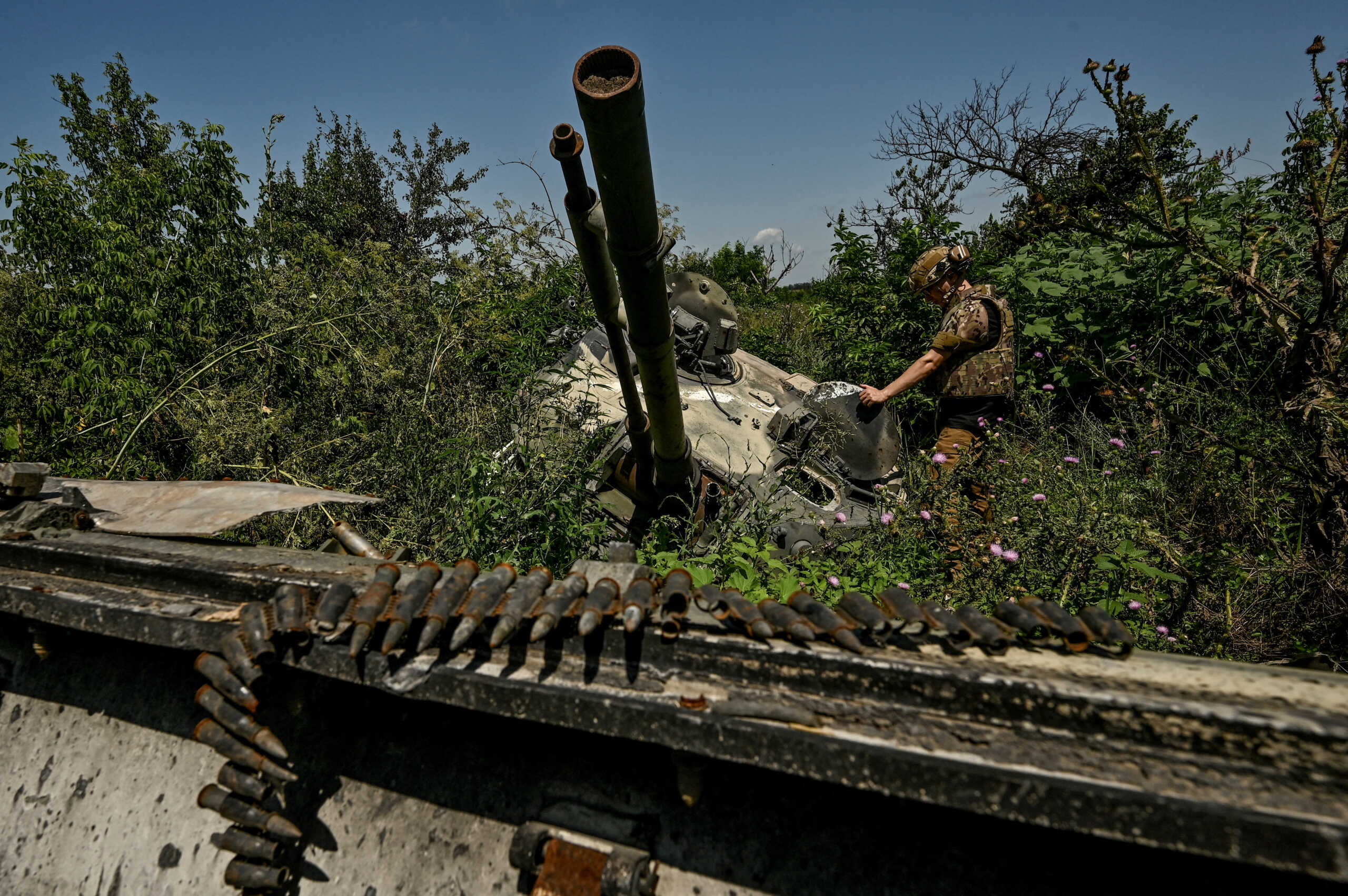 FILE PHOTO: A Ukrainian serviceman inspects a turret of a destroyed Russian BMP-3 infantry fighting vehicle in the recently liberated village of Novodarivka, amid Russia's attack on Ukraine, in Zaporizhzhia region, Ukraine July 21, 2023. REUTERS