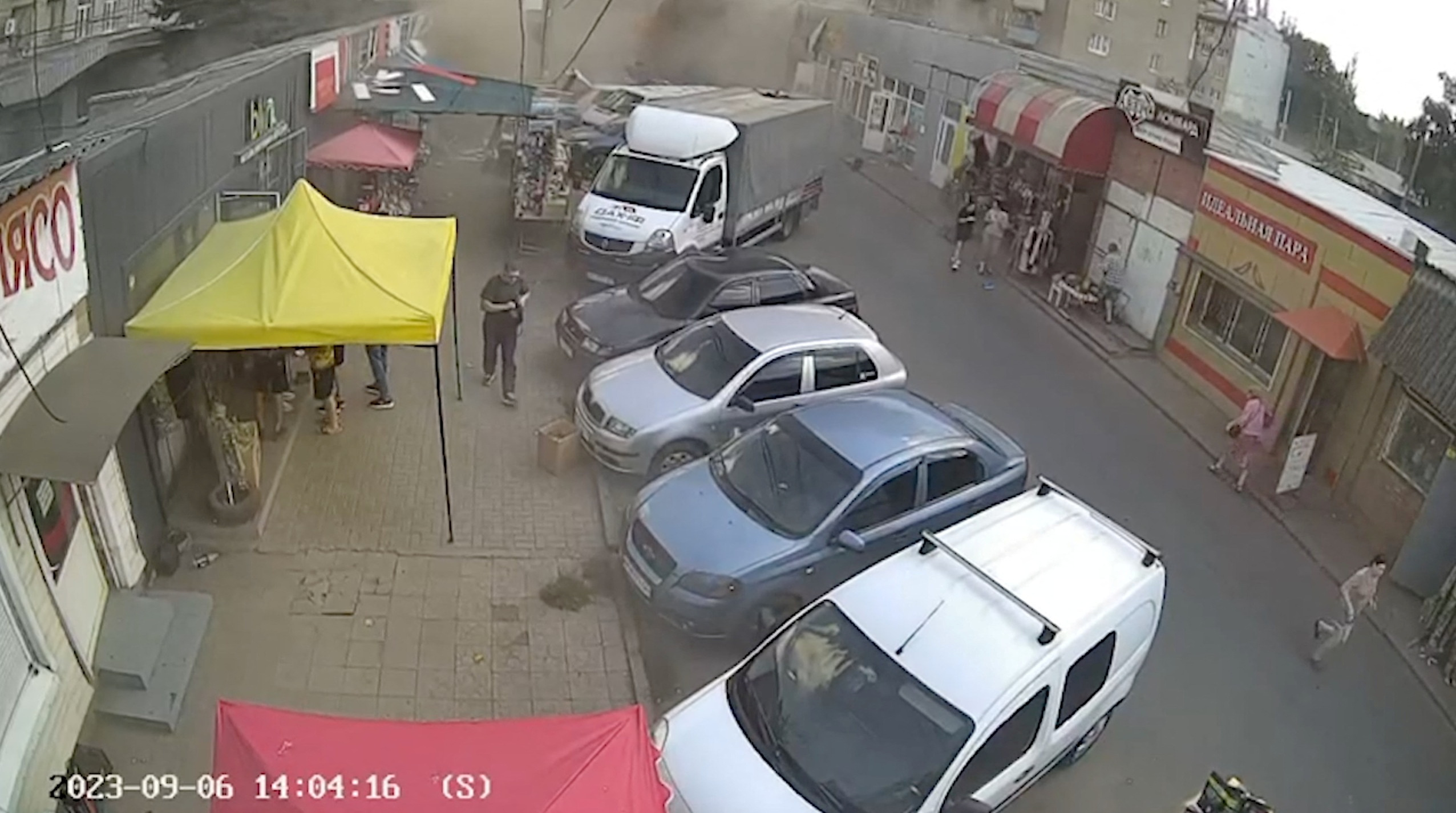 Smoke is seen and people run following an attack on the city of Kostiantynivka in eastern Ukraine, September 6, 2023, according to presidential adviser Mykhailo Podolyak, in this still image from video obtained from social media. Volodymyr Zelenskiy Via Telegram