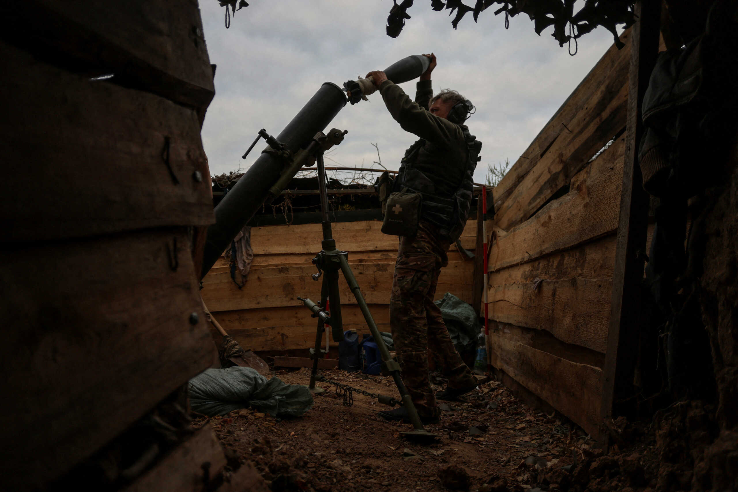 FILE PHOTO: A Ukrainian serviceman loads a shell into a mortar as he fires toward Russian troops at a position near a frontline, amid Russia's attack on Ukraine, in Zaporizhzhia region, Ukraine September 4, 2023. REUTERS